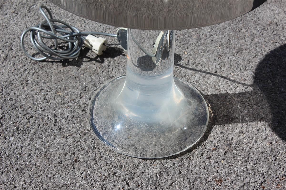 Round Harvey Guzzini table lamp Lucite steel Italian design 1970s silver.
In the upper part it has an E27 bulb max 80 watts, in the lower part inside 3 bulbs E14 Max 40 Watts.