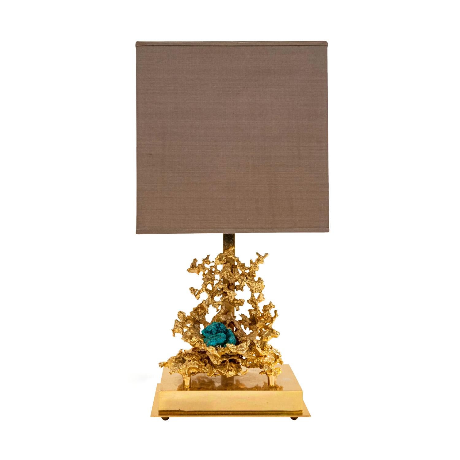Stunning table lamp in 24-karat gold plated exploded-bronze with beautiful malachite elements in the manner of Claude Victor Boeltz, France 1970's. This lamp is work of art. It has been rewired with American sockets and silk cord with switch. New