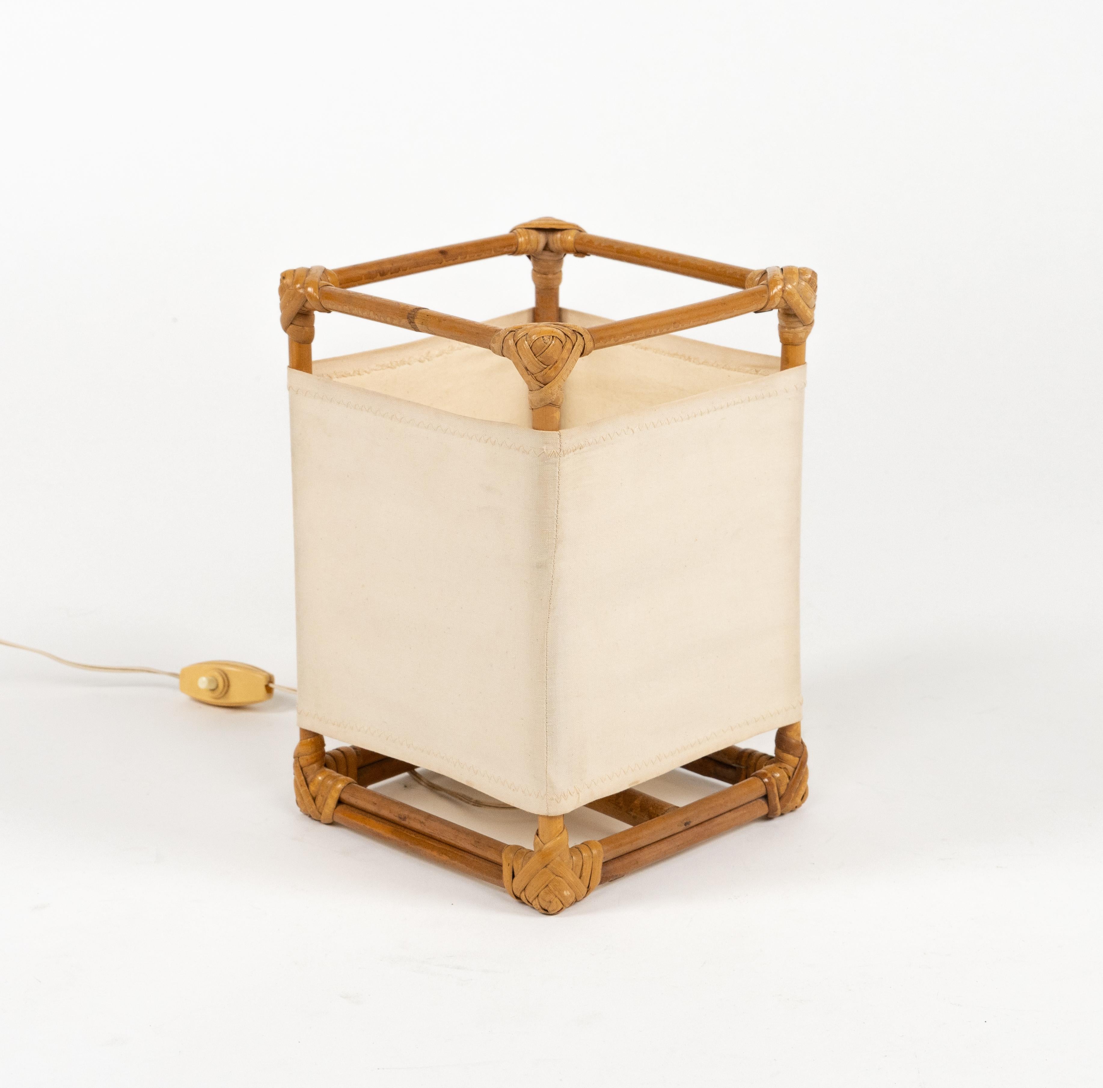 Midcentury beautiful table lamp in bamboo, rattan and fabric attributed to Louis Sognot.

Made in France in the 1960s.

It uses 1 bulbs. 

European plug (works outside EU with a simple plug adapter).

