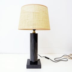 Table lamp in black marble and natural raffia lampshade