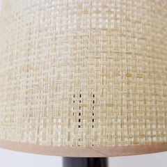 Table lamp in black marble and natural raffia lampshade