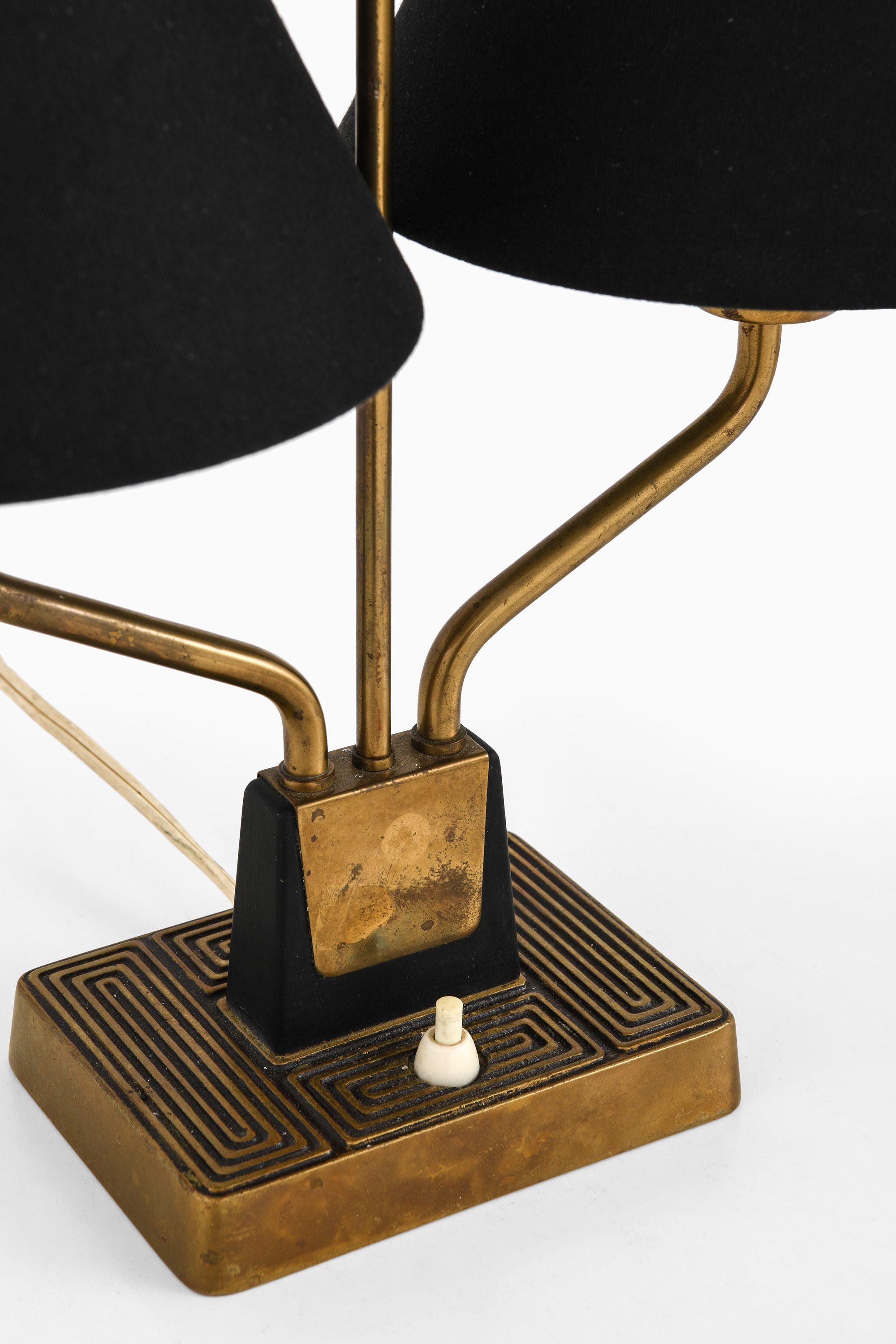 Table Lamp in Brass and Black Fabric Lamp Shades by Sonja Katzin, 1950's

Additional Information:
Material: Brass and black fabric lamp shades
Style: Mid century, Scandinavian
Produced by ASEA in Sweden
Dimensions (W x D x H): 42 x 20 x 42