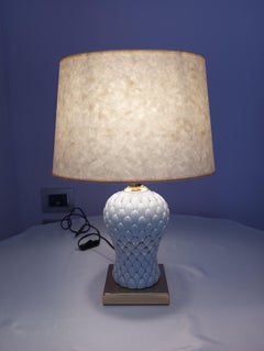 Table lamp in brass and porcelain attributed to Tommaso Barbi, 1980s.