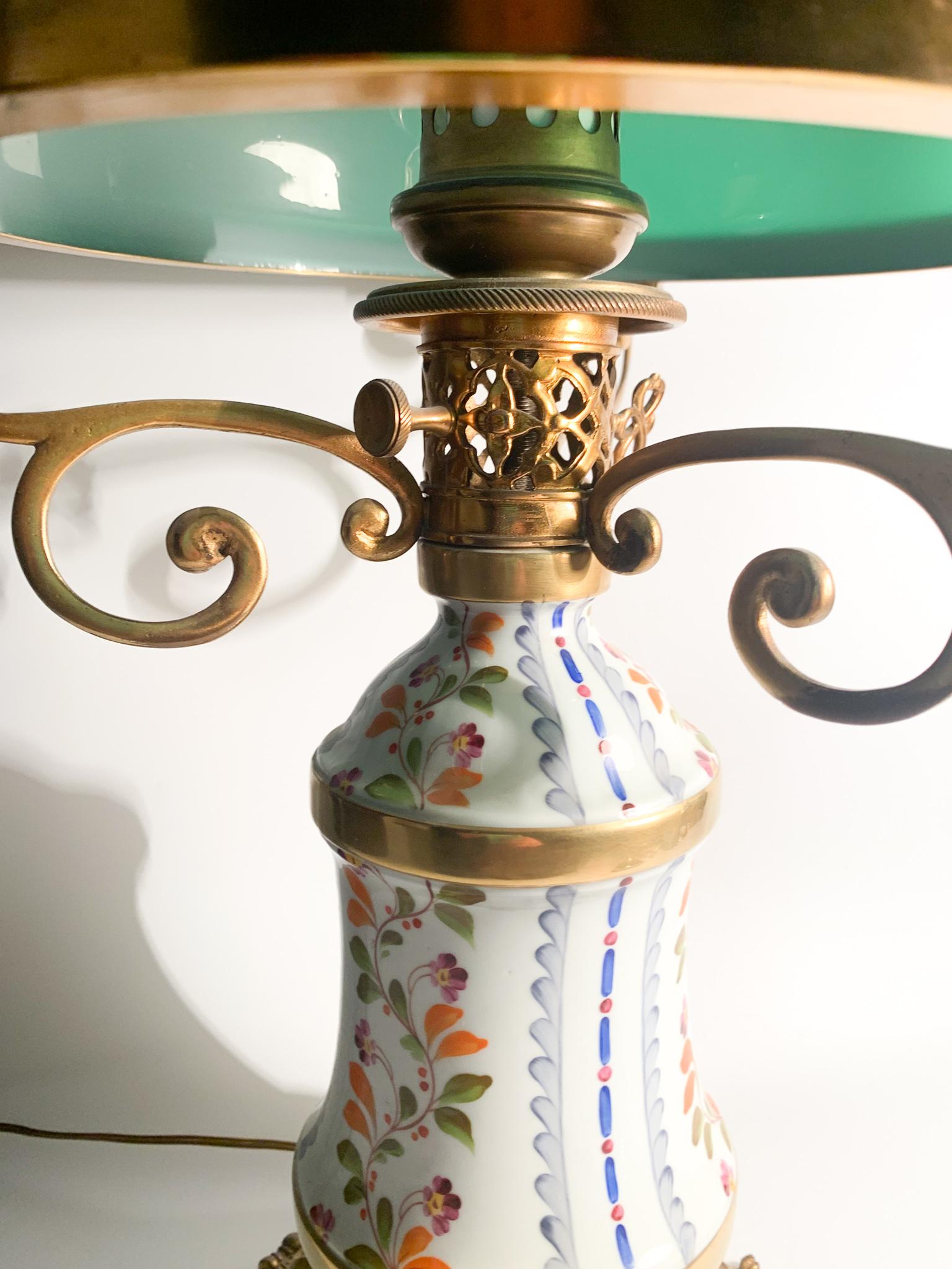 Hand painted Sevres porcelain table lamp, with bronze structure and green glass shade, made in the 1940s

Sèvres ceramics are one of the most famous ceramic manufacturers in all of Europe, born in France in the 18th century. From the beginning,