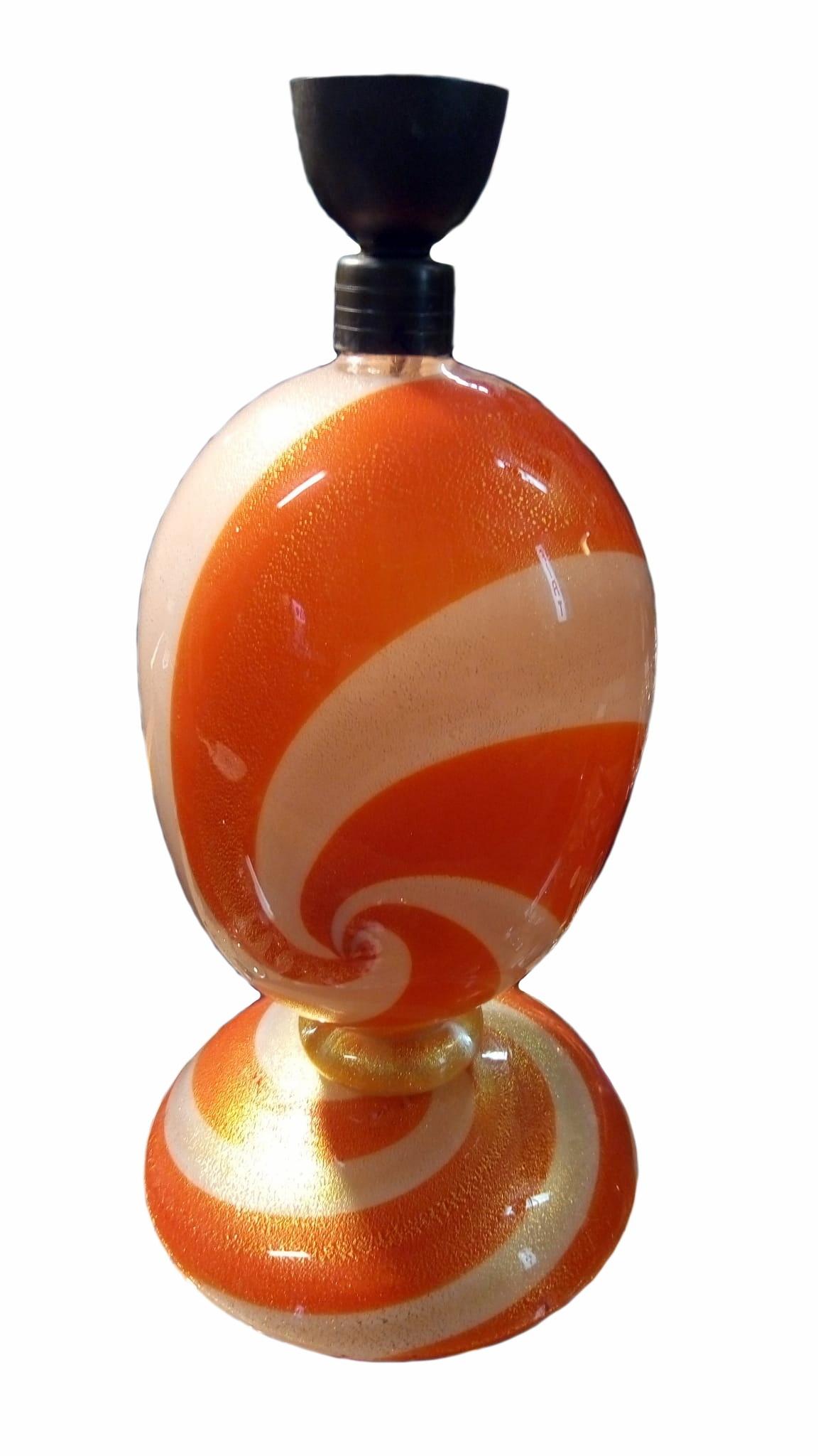 This is a table lamp by Seguso, Murano Italy, in an orange and white swirl design almost looking like a candy cane from the 1960s. And of course the lampshade can be altered if needed. In very nice condition without chipping or cracks. Stands 48 cm