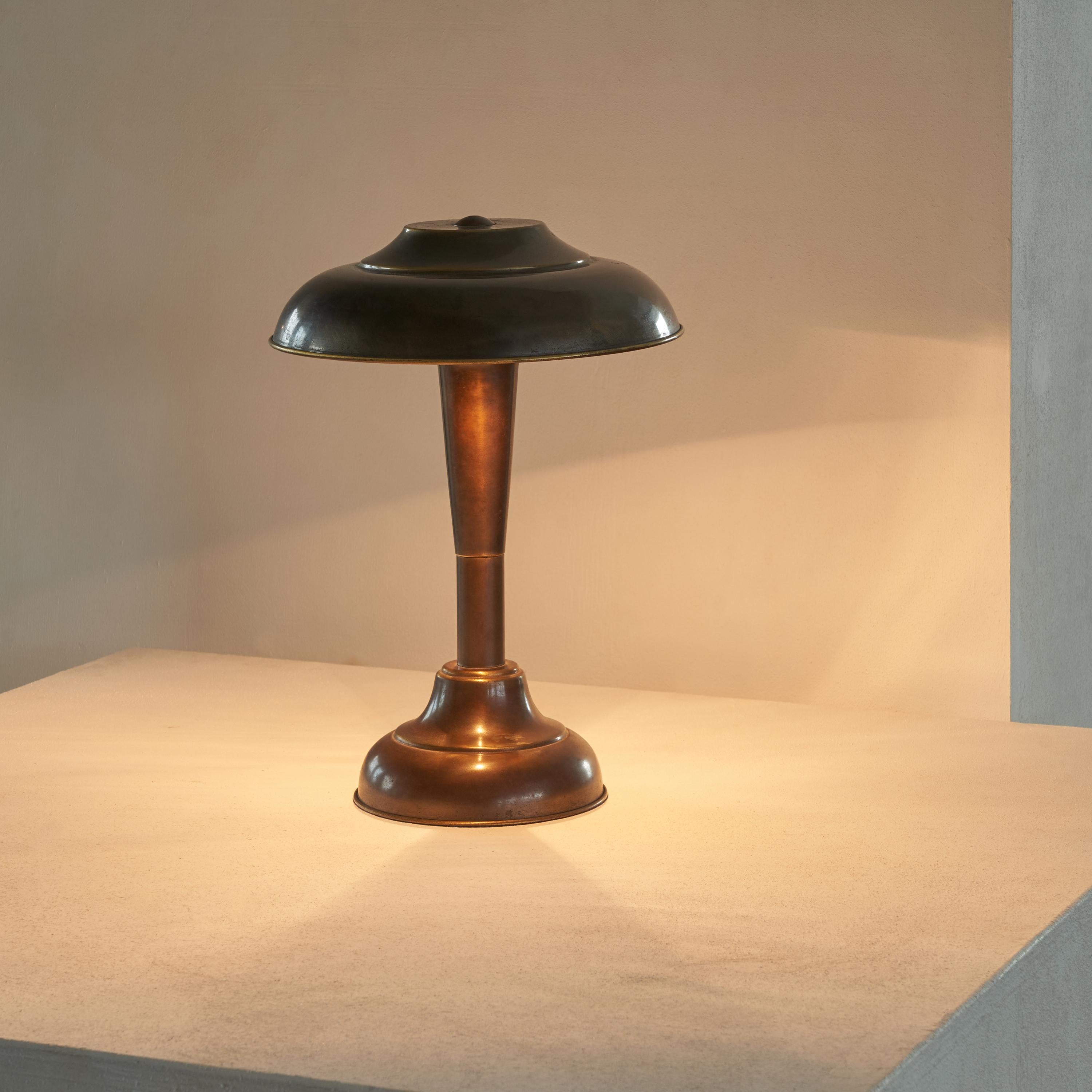 Art Deco table lamp in Patinated brass 1950s.

This is a wonderfully patinated table lamp in a distinct art deco style, probably made in the 1950s. A very rich and elegant design, with good proportions and details. 

The most beautiful feature