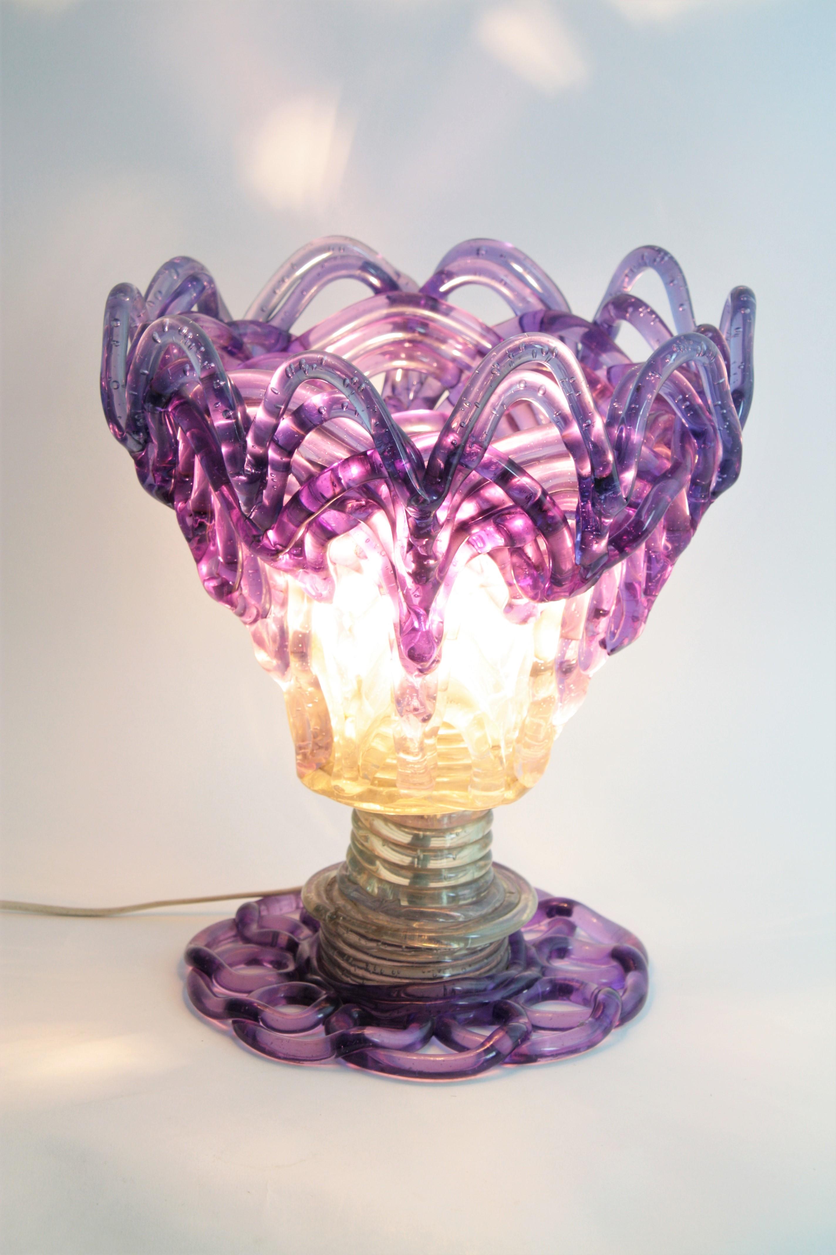 Midcentury table lamp, purple / clear Lucite, Spain, 1960s
This eye-catching uplighter table lamp features an structure made of interlaced cilindric pipes in two colors.
Purple accents at the top and at the bottom.
Rare find.
Measures: 35 cm H x