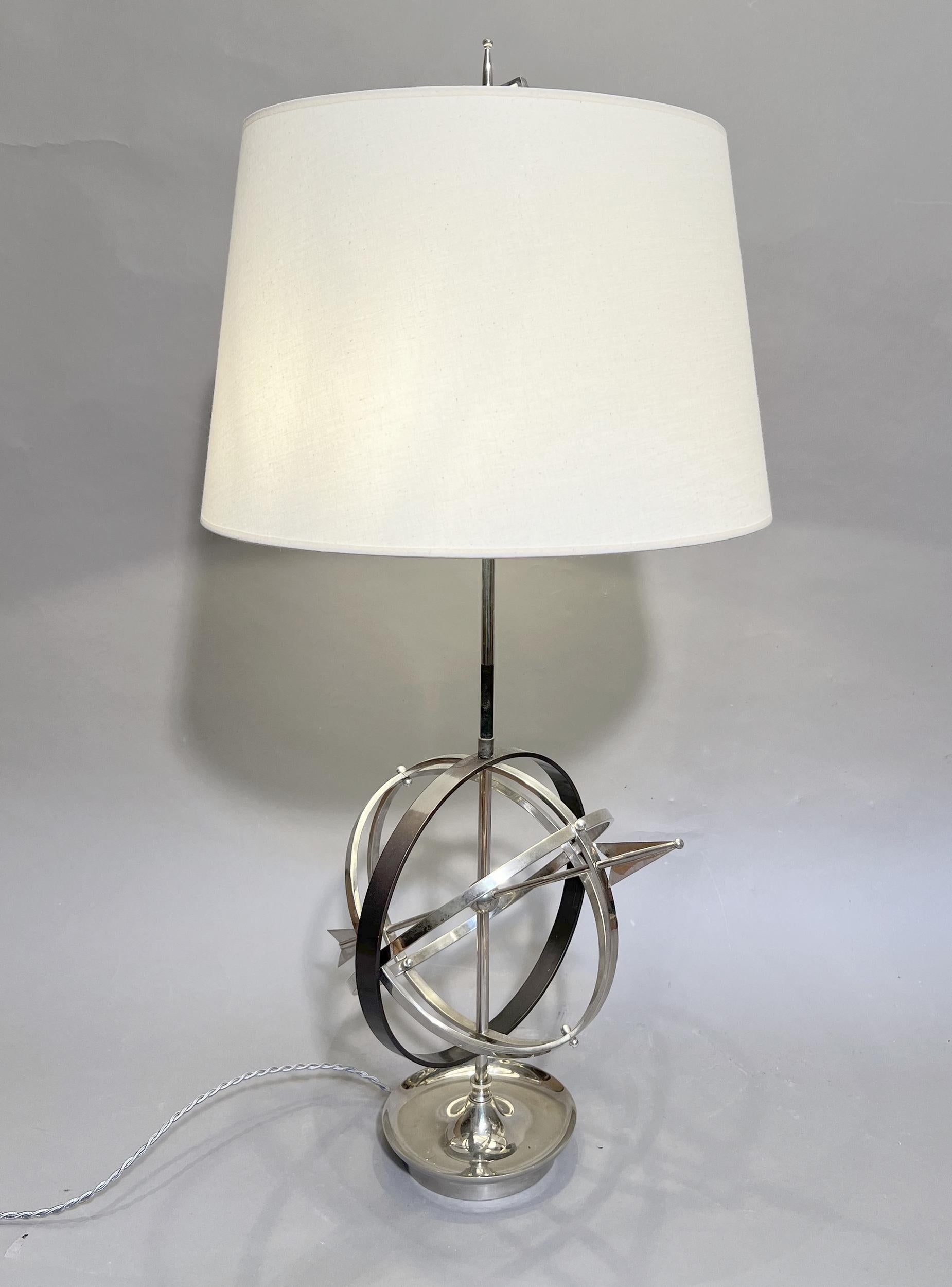 Large « bouillotte » style lamp in the shape of a celestial globe in silver-plated metal and metal with bronze patina. Recent lampshade identical to the original.
Two light bulbs.
Height: 84 cm (33 inches)
Lampshade diameter: 40cm (15.8 inches)
Base