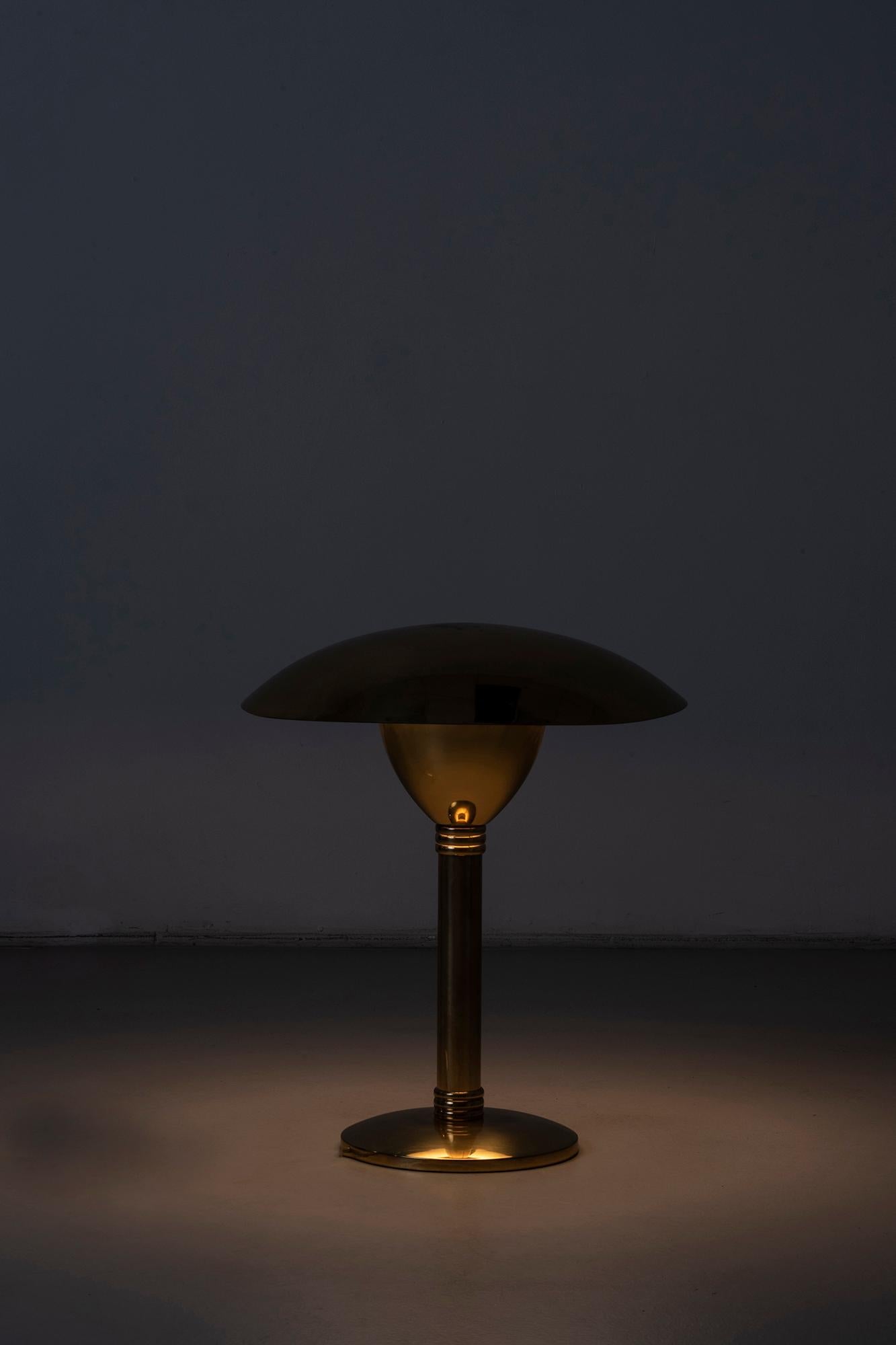 Table lamp in the style of Paavo Tynell
Finland, 1960s
Brass.