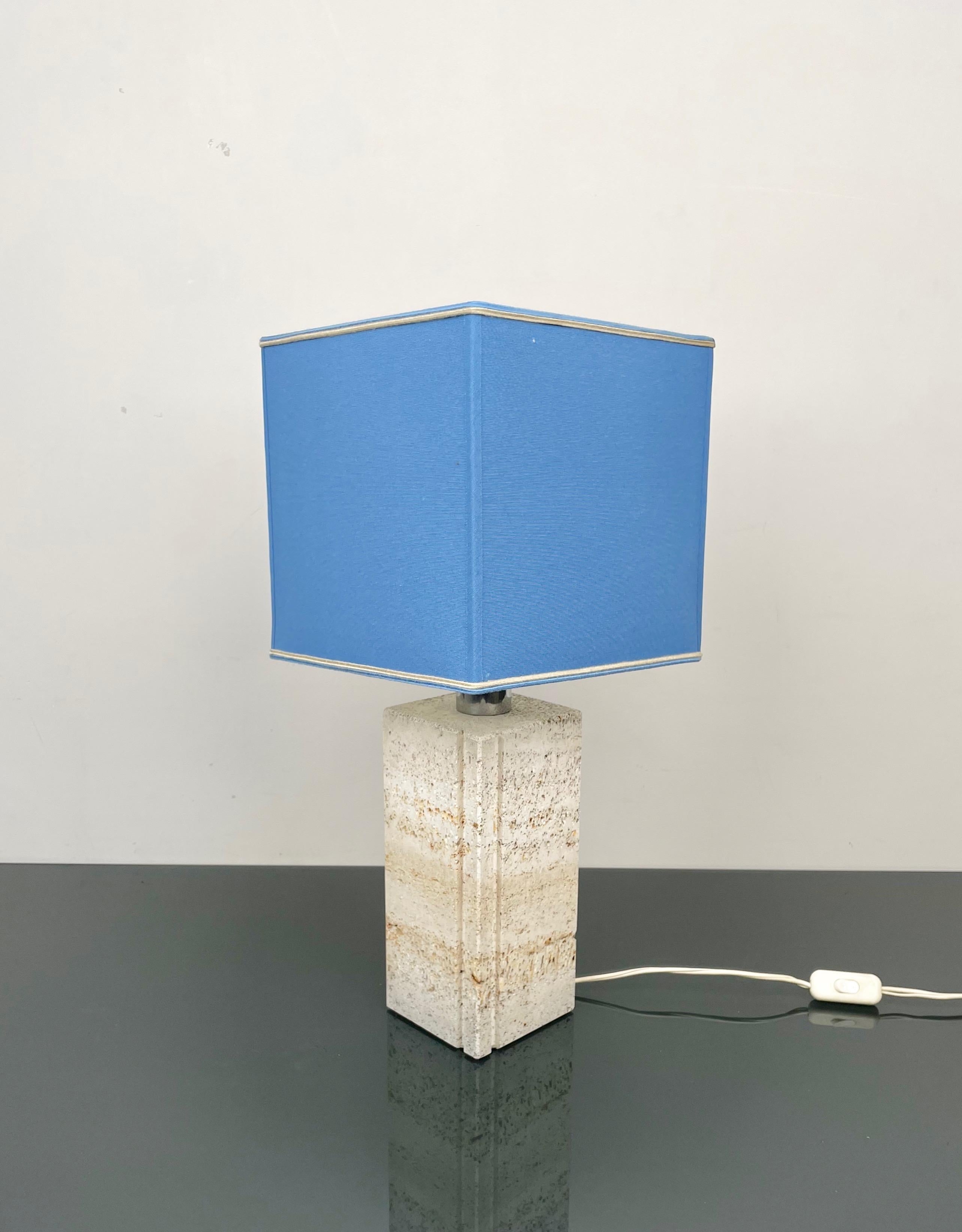 Beautiful table Lamp in travertine, chrome and original lampshade in silk by the Italian design Fratelli Mannelli.

Made in Italy in the 1970s.

The original label is still attached as shown in the pictures.


Dimensions without lampshade: H