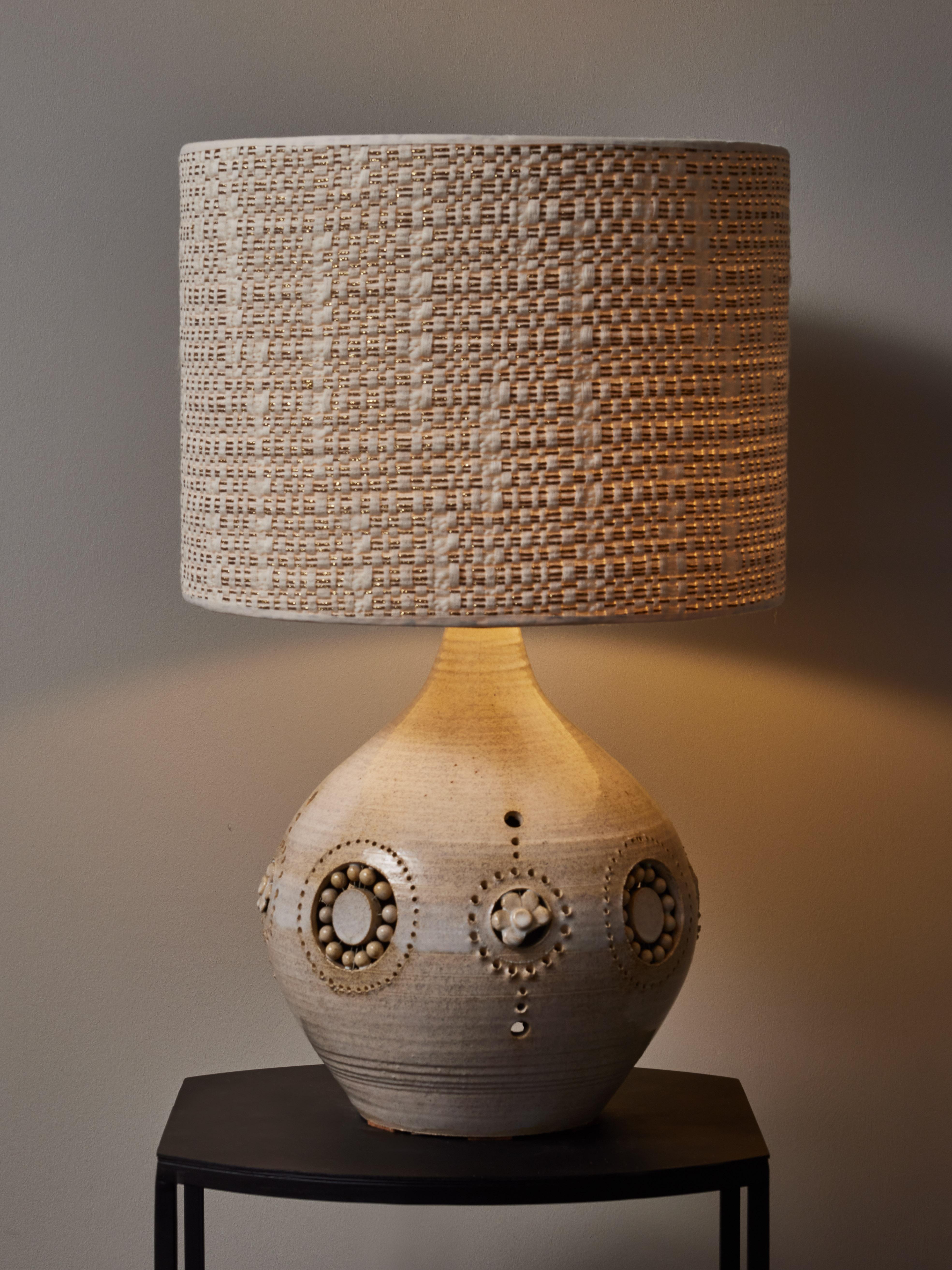 Ceramic table lamps made by Georges Pelletier, uniform glaze with flower decors.

Georges Pelletier
Born in 1938 in Brussels, Belgium, Georges Pelletier is a ceramist who lives and works in Cannes, France. His ceramics are highly sought by art