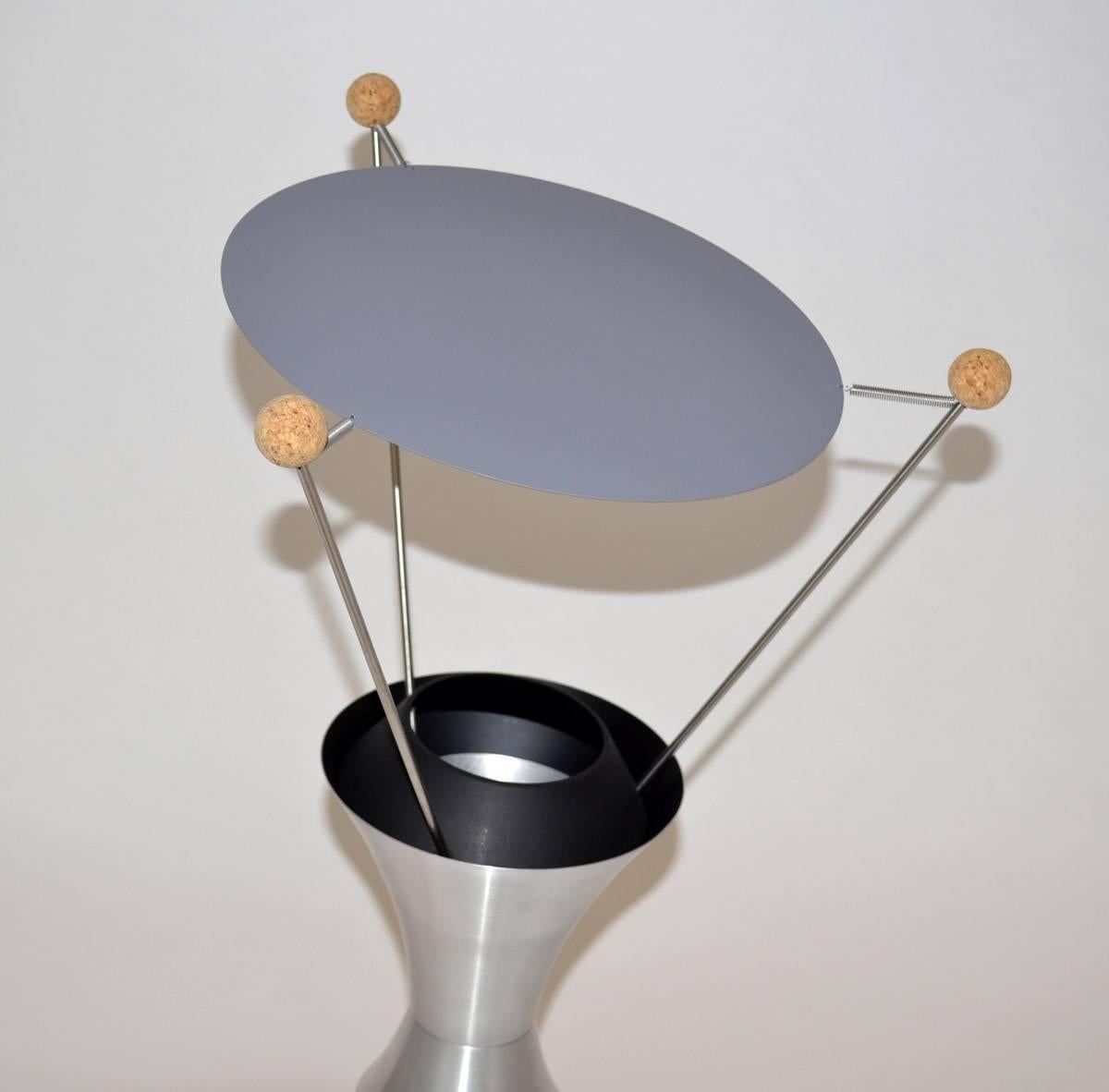 Atomic Mid-Century by James Harvey Crate T-3-C adjustable table lamp reissue of the 1951 MOMA winner of low cost lighting design. Signed and numbered no. 20, circa 2000. Aluminium, cork, wire, enameled metal.