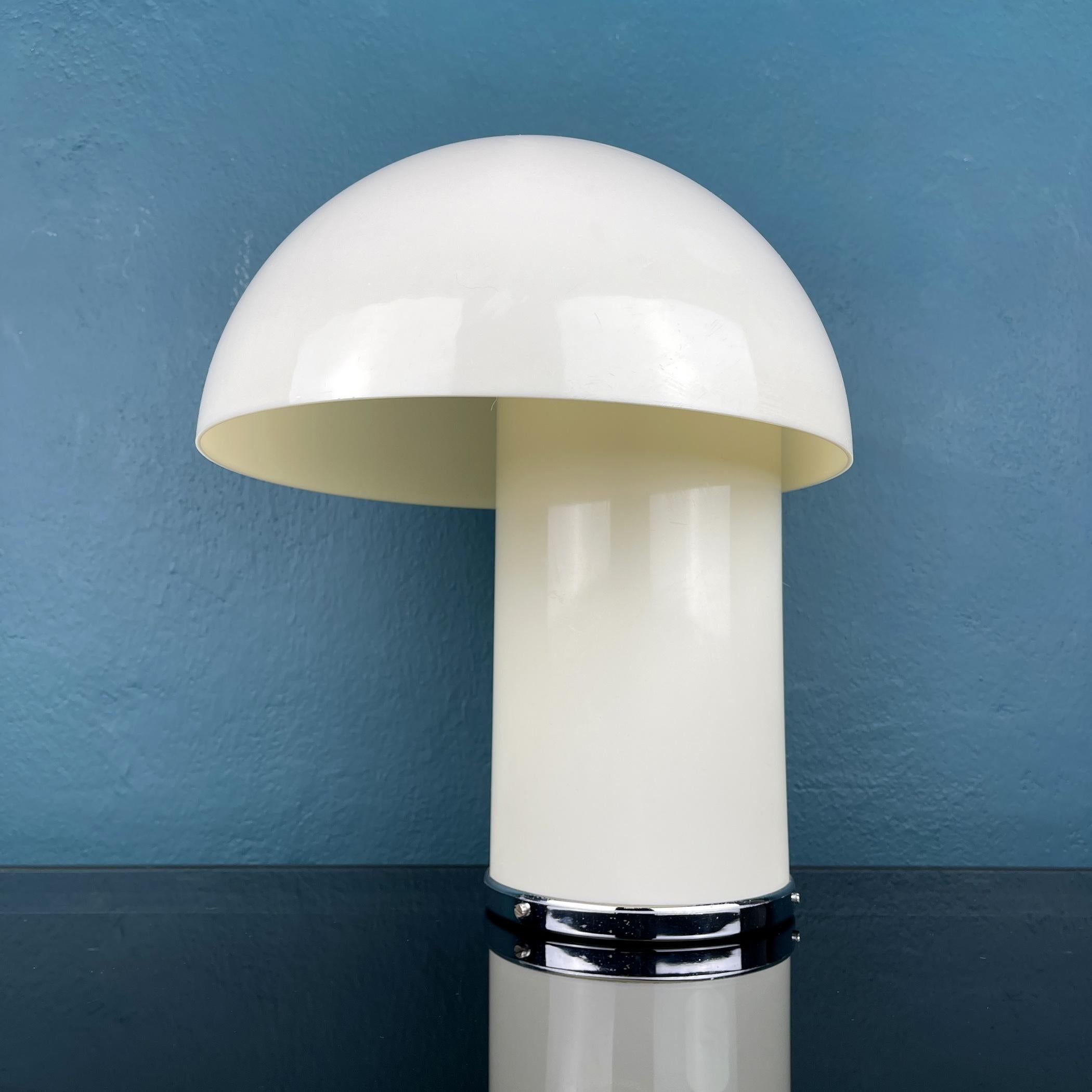 Very rare table lamp Leila was designed Verner Panton and Marcello Siard for Collezioni Longato Padova in Italy in the 1968. The lampshade merges with the trunk in a special way when it is lit, the metal chromed base. Good vintage condition with