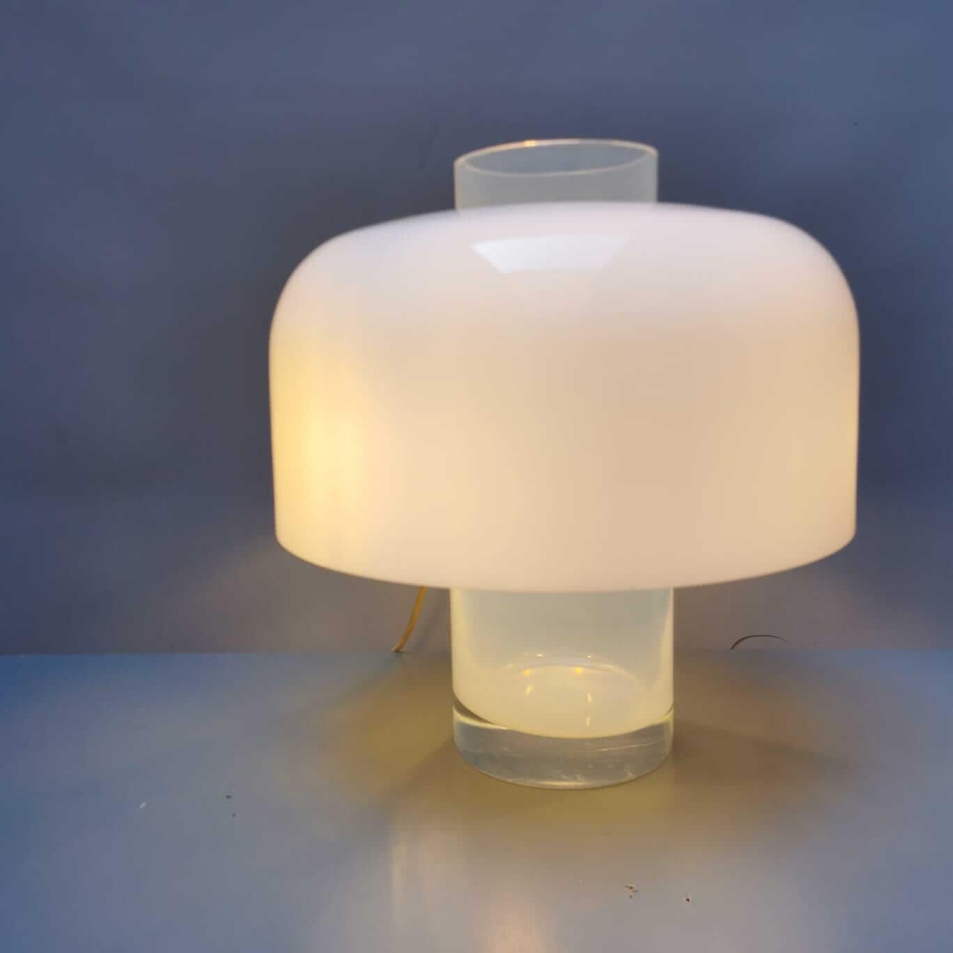 Table lamp with a solid Murano glass frame and an encased Murano glass diffuser. The blue base of the lamp can, as described in A.V. Mazzega - Catalogue No. 9, be used as a vase. Prod. Mazzega, Italy, circa 1960.

The object has no defects, only