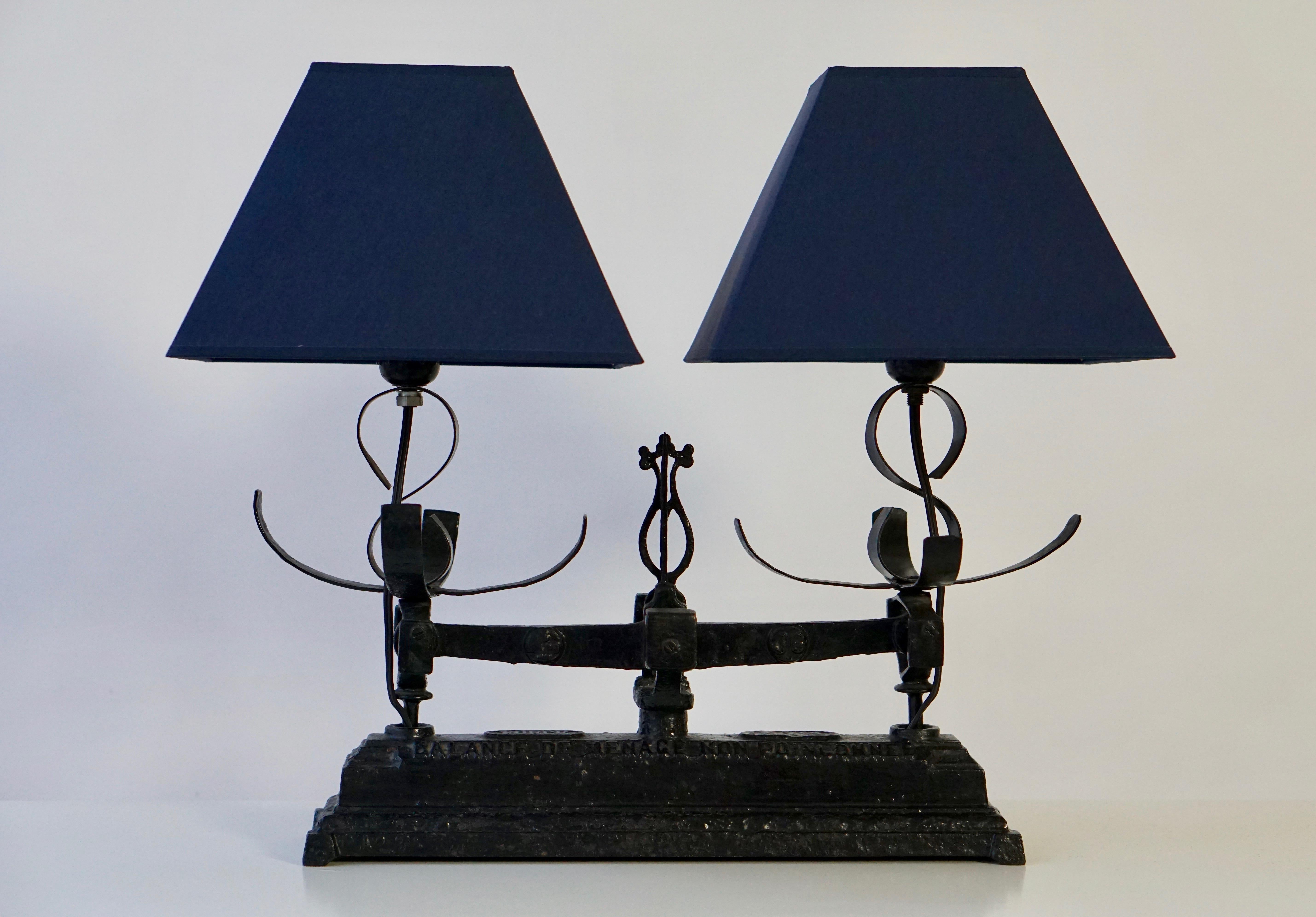 Table lamp made of an old wrought iron balance, scale.
Measure: Width 48 cm.
Depth 20 cm.
Height with socket 34 cm.
Weight 5 kg.
Lamp shades are not included in the price.