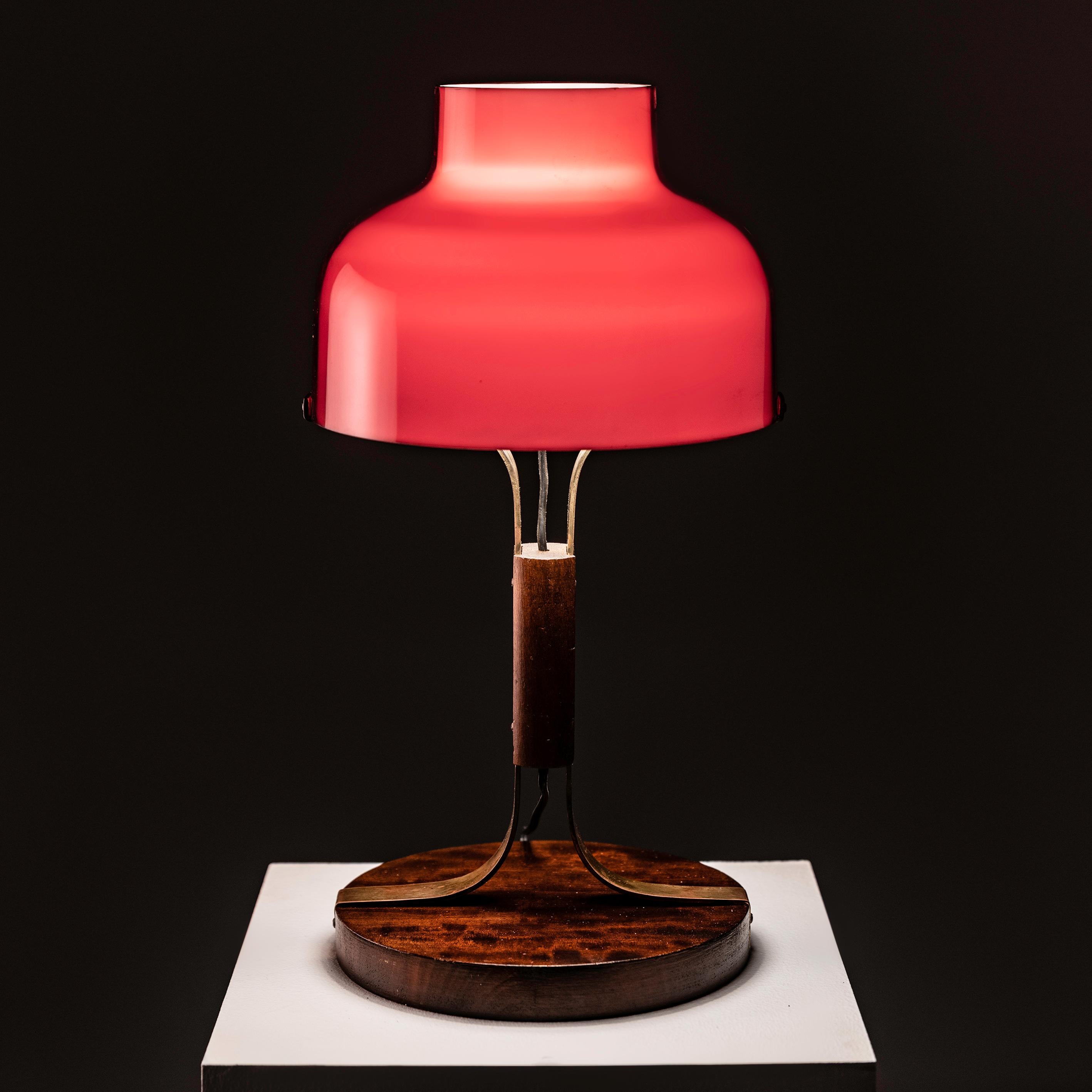 Investing in the Max Bill table lamp designed by Miguel Mila for Polinax in Spain during the 1960s offers a remarkable opportunity to acquire a piece of iconic mid-century modern design. Miguel Mila's collaboration with Polinax resulted in a lamp