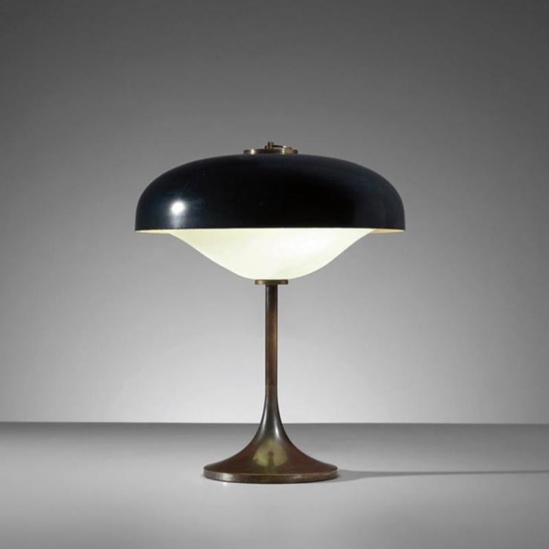 Modernist table lamp, mod. 12827s, Italy, circa 1960 by Vittorio Gregotti, Lodovico Meneghetti, Giotto Stoppino, 
cat. 316.  Frosted glass, enameled metal , patinated brass. Contains two candelabra base sockets. 
