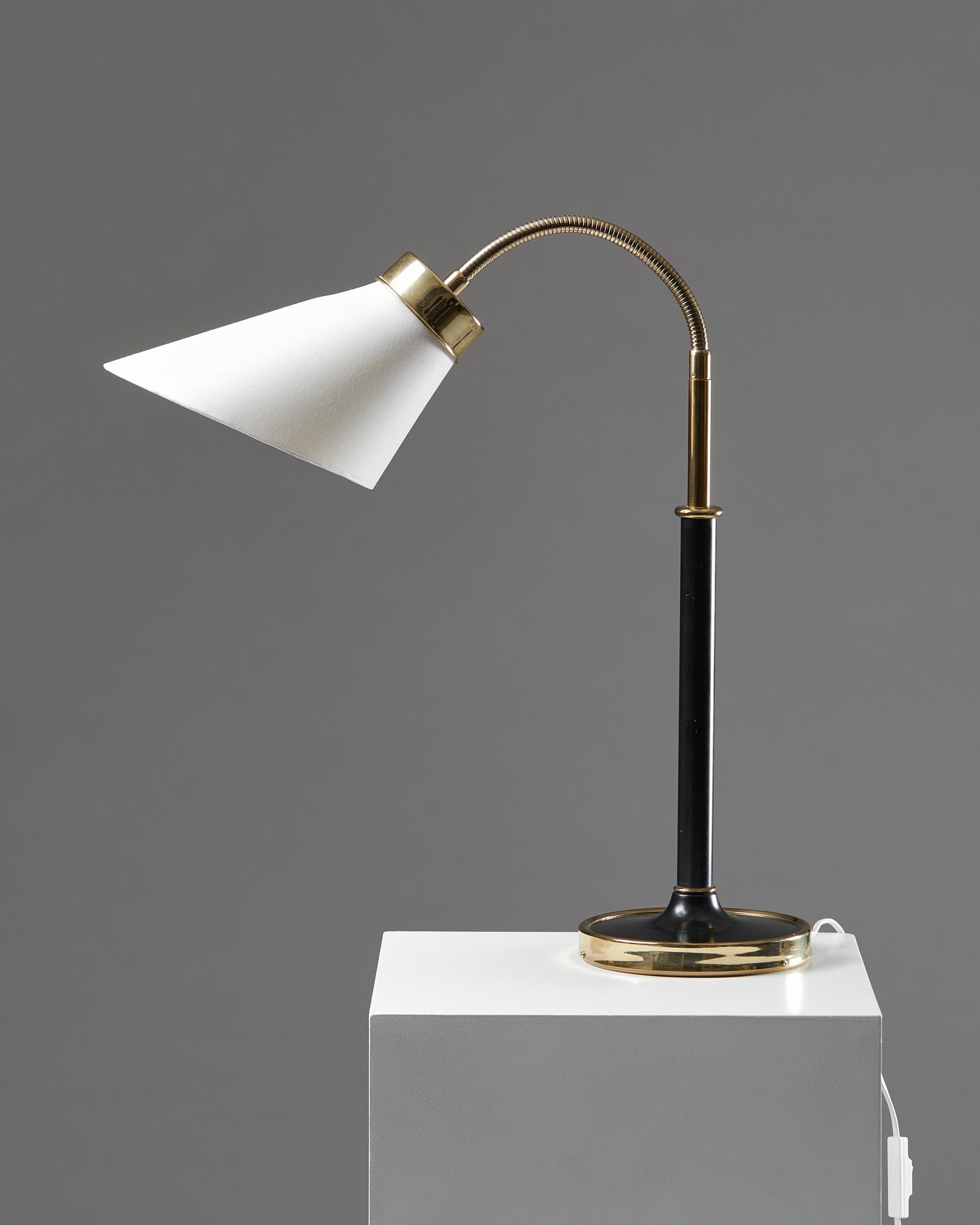 Table lamp model 2434 designed by Josef Frank for Svenskt Tenn,
Sweden, 1939.

Polished and lacquered brass with fabric shade.

Dimensions:
H: 58.5 cm / 1' 11