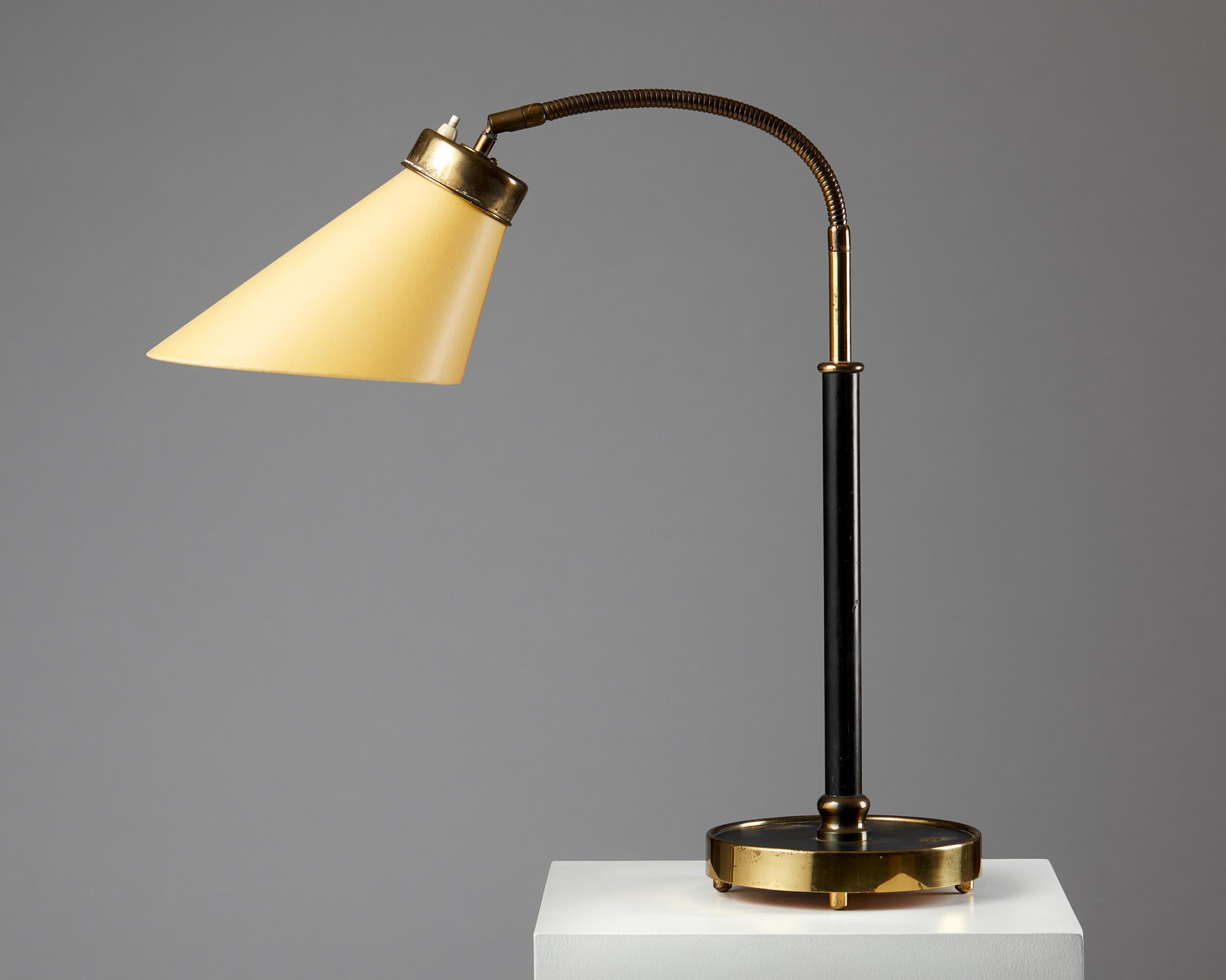 Table lamp model 2434 designed by Josef Frank for Svenskt Tenn,
Sweden, 1939.

Early model.

Leather and brass with fabric shade.

Measures: 
H: 61 cm
W: 21 cm
D: 62 cm

Josef Frank was a true European, he was also a pioneer of what would become