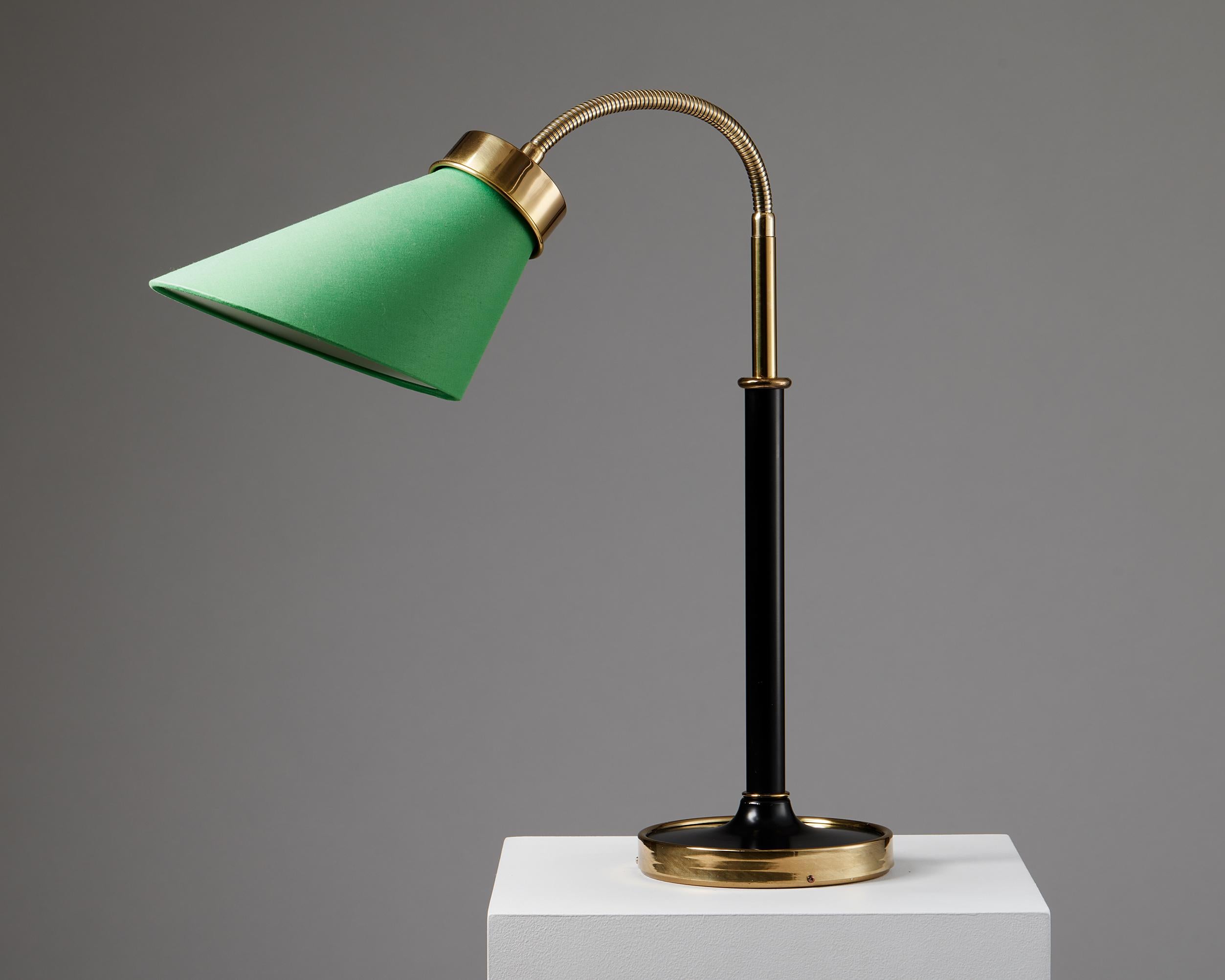 Table lamp model 2434 designed by Josef Frank for Svenskt Tenn,
Sweden, 1939.

Polished and lacquered brass with fabric shade.

Measures: 
H: 58 cm
W: 50 cm

Josef Frank was a true European, he was also a pioneer of what would become classic 20th