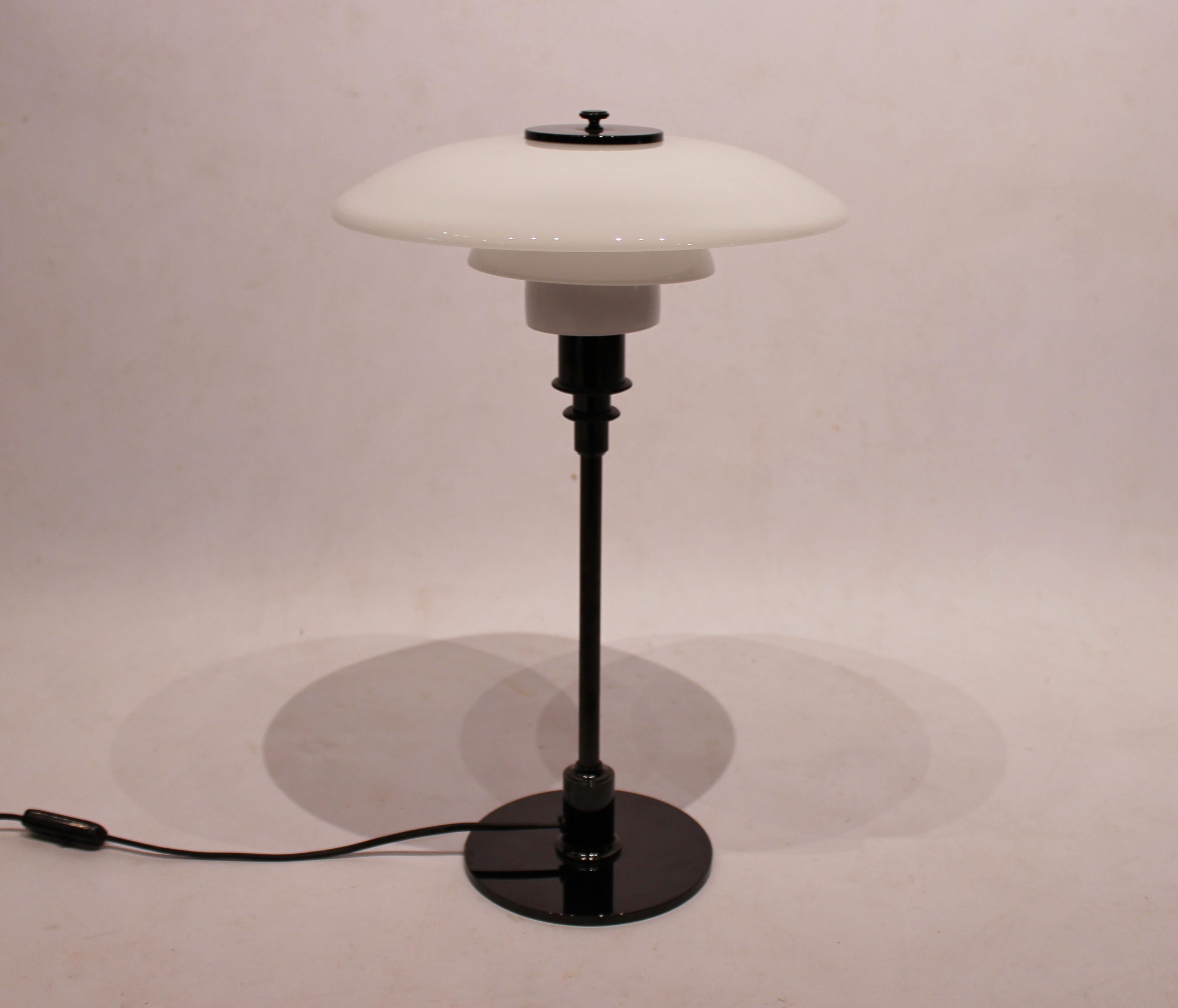 Table lamp, model 3/2, with black frame and opaline glass, designed by Poul Henningsen and manufactured by Louis Poulsen. The lamp is from the 1980s and in great vintage condition.