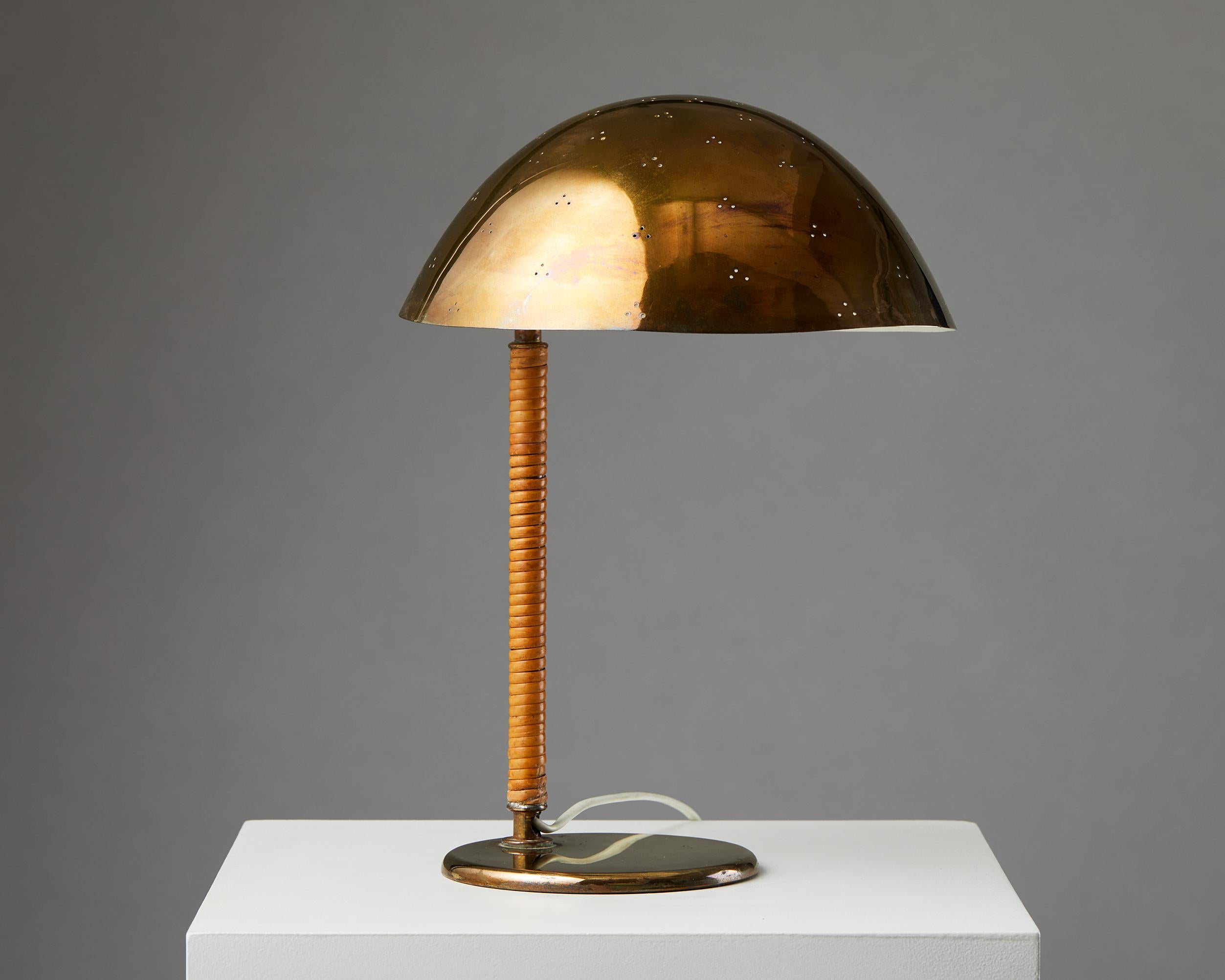 Table lamp model 9209 designed by Paavo Tynell for Taito Oy, Finland, 1950s.

Pierced brass and cane. 

Stamped “OY TAITO AB 9209 MADE IN FINLAND”.

Dimensions:
Measures: H: 38 cm / 15’’
W: 26.5 cm / 10 1/2’’
D: 26 cm / 10 1/4’’.

One of the best