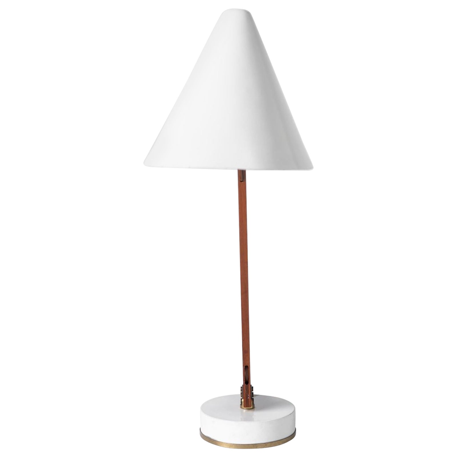 Table lamp, Model B-54 by Hans-Agne Jakobson for AB Markaryd. Lamp swivels 360 degree and is constructed with at eak angular arm with brass fittings and enameled metal shade and base. In very good original condition.