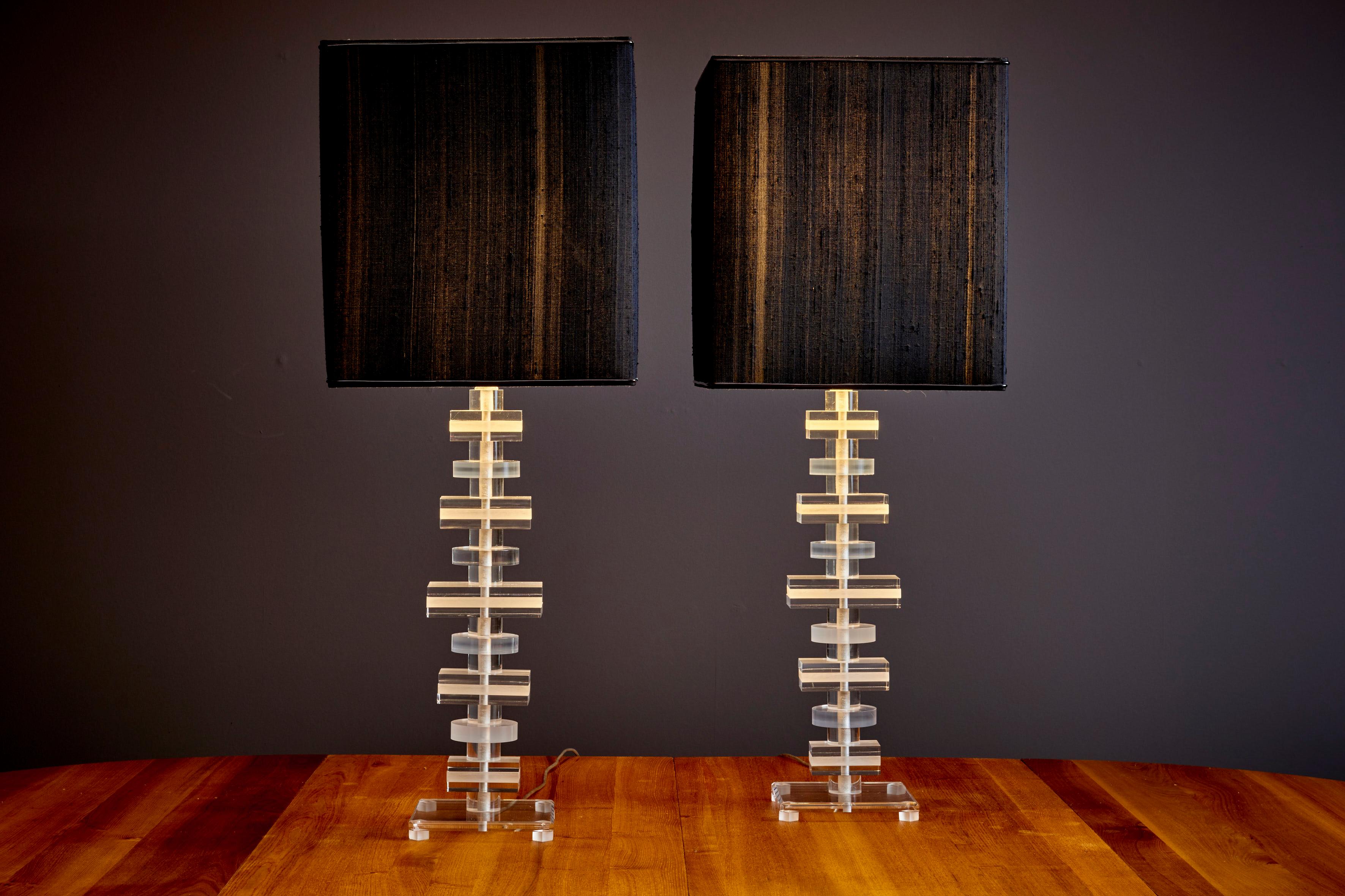 Pair of Lamps in Plexiglass with black shade in the style of Karl Springer, 1970s.

Please note: Lamp should be fitted professionally in accordance to local requirements.