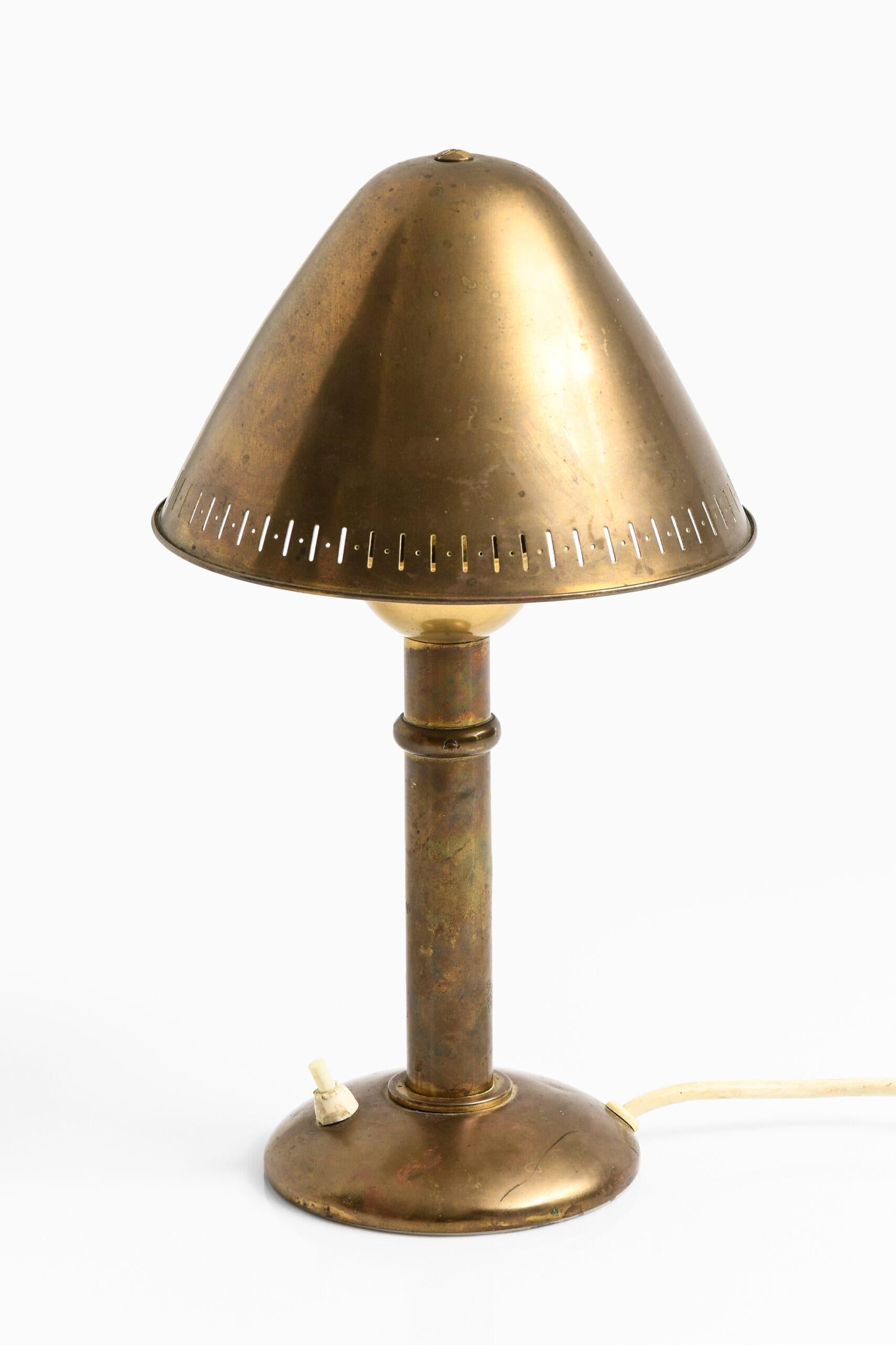 Rare table lamp with adjustable shade by unknown designer. Produced by ASEA in Sweden.