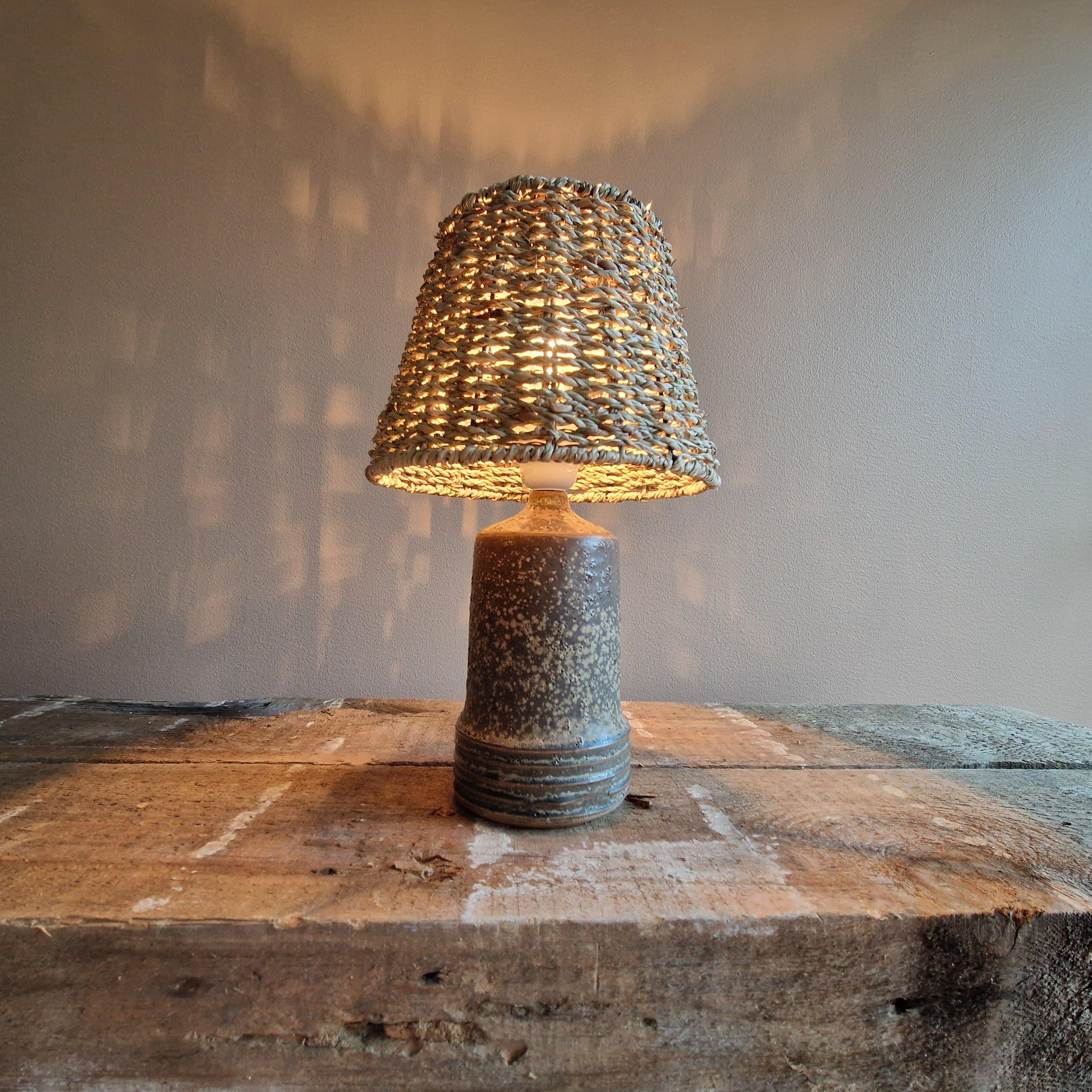A table lamp made by Rolf Palm. Probably for Mölle, Sweden. 1950's. New seagrass lamp-shade.

Hight 24/32 cm. 
Width 11/20 cm.

New wiring. A very small chip on the underside next to the signature.