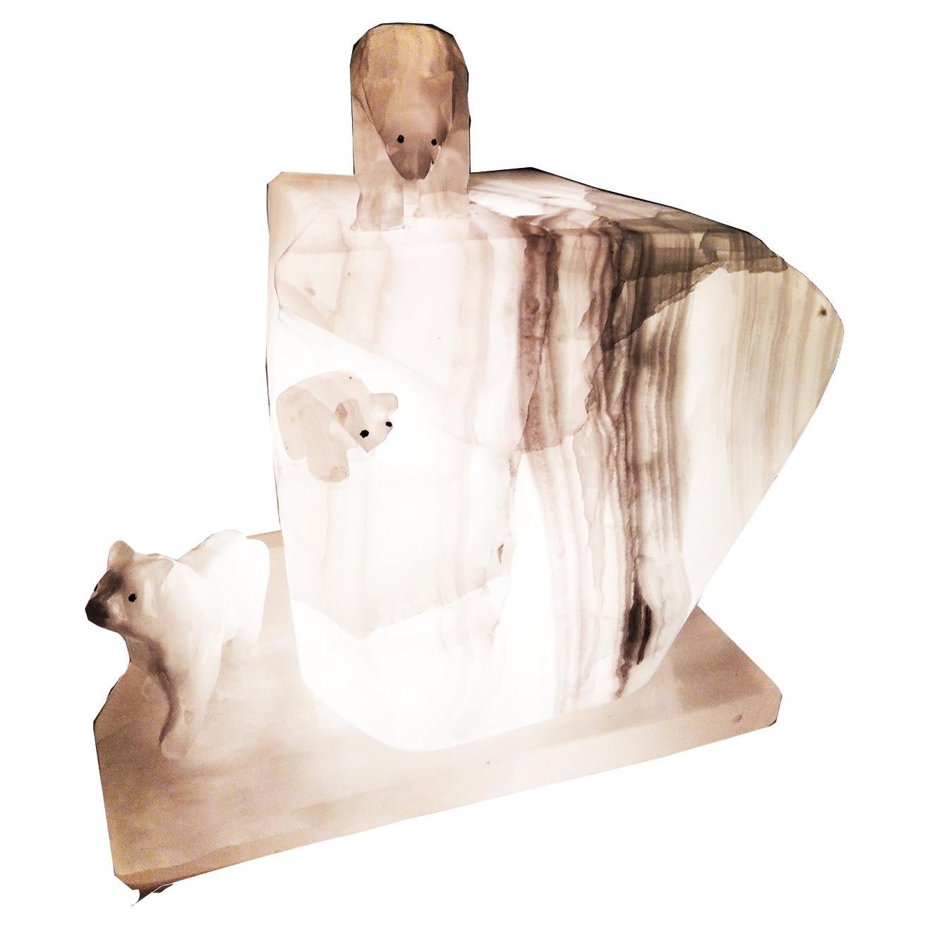The energy of onyx properties
This semi-precious stone, being porous and absorbent, attracts negative energy and dissolves it.

Beautiful veined white onyx lamp in the shape of an Iceberg on which three white polar bears stand
It emits a soft