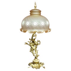 Table lamp with a tall base.