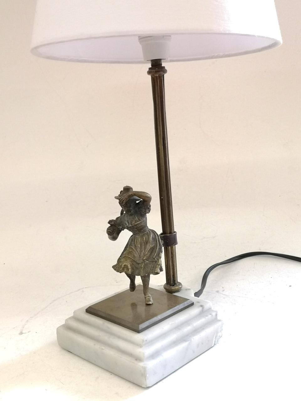 Table lamp with bronze cast on a marble base, 1920s.