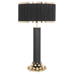 Table Lamp with Cylindrical Design Featuring Brass Base and Pearl Accents