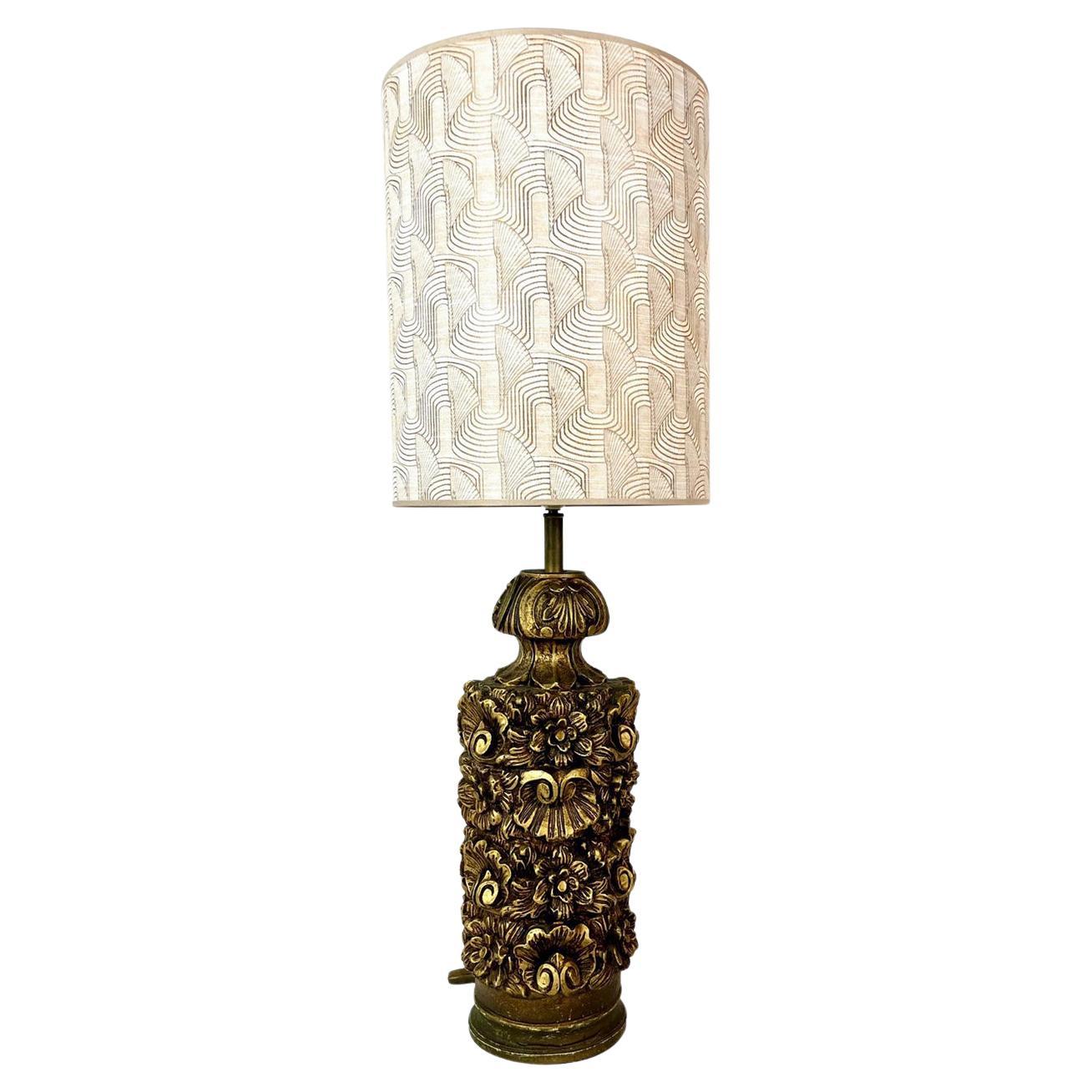 Stylish Italian table lamp. The table lamp is handcrafted with a floral pattern and painted with gold paint. 
Inclusive lamp shade with bronze inner shade

The lamp is from the 1950s and is still in very good condition. 

