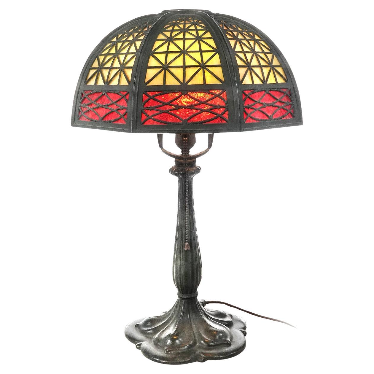 Table Lamp with Heavy Latticework Filigree and Red/Amber Glass