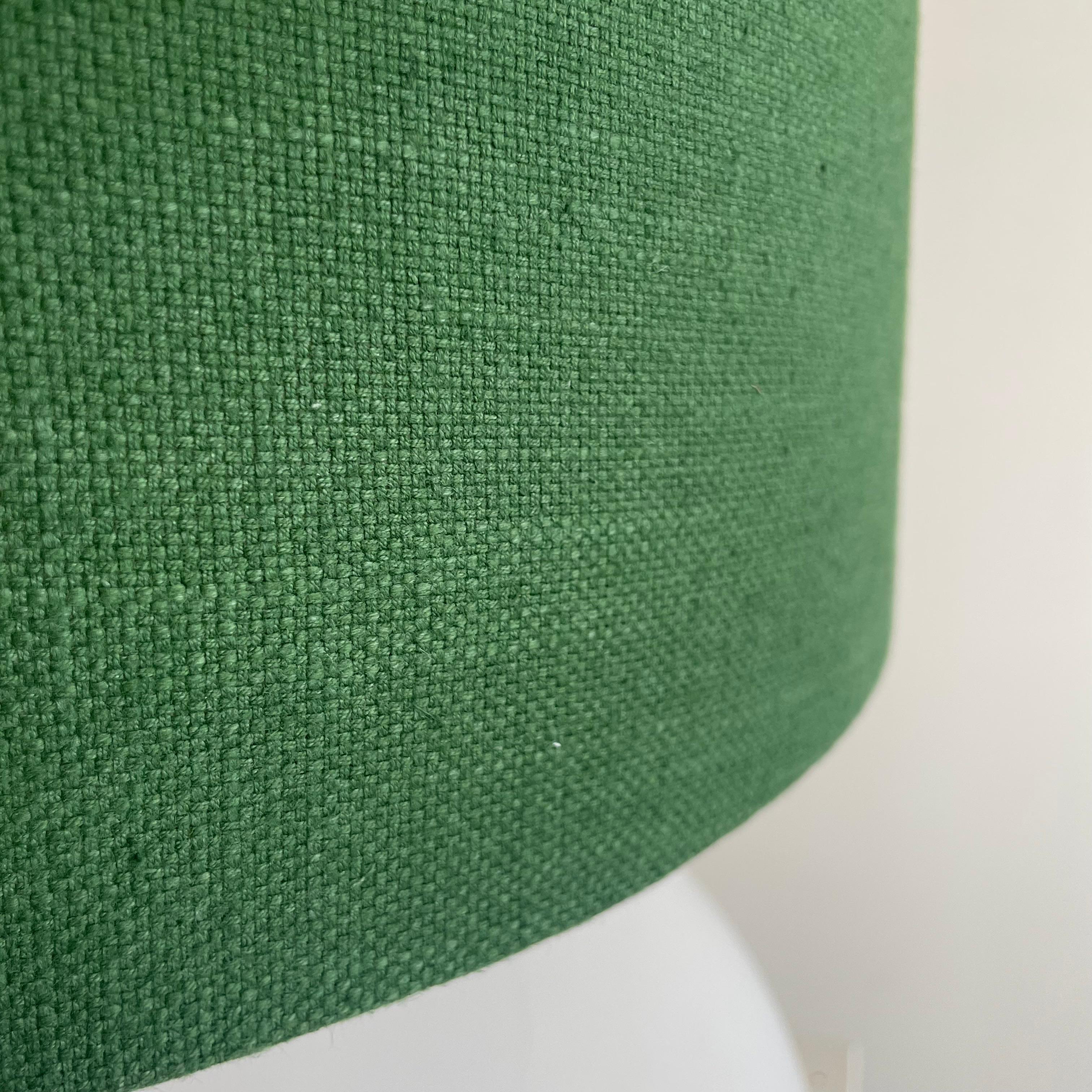 Table lamp with olive green coloured Lampshade. France, 1970s.

Large table lamp with illuminated opaline glass base and green coloured linen lampshade. One E27 fitting is in the base, and one E27 fitting is used for the lampshade.

Condition: 