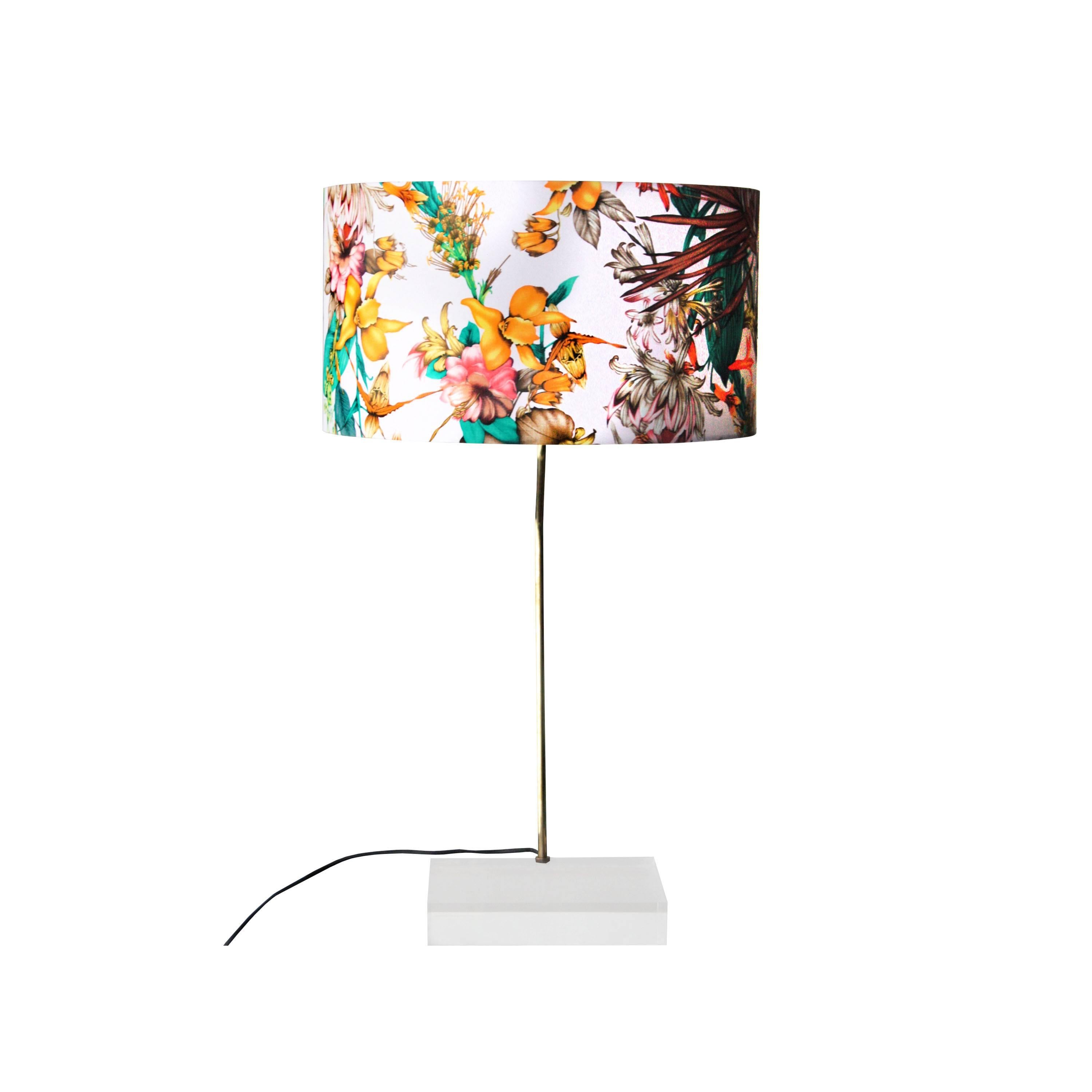Table lamp consisting of a methacrylate base with brass structure and lamp screen with flower print upholstery.
 