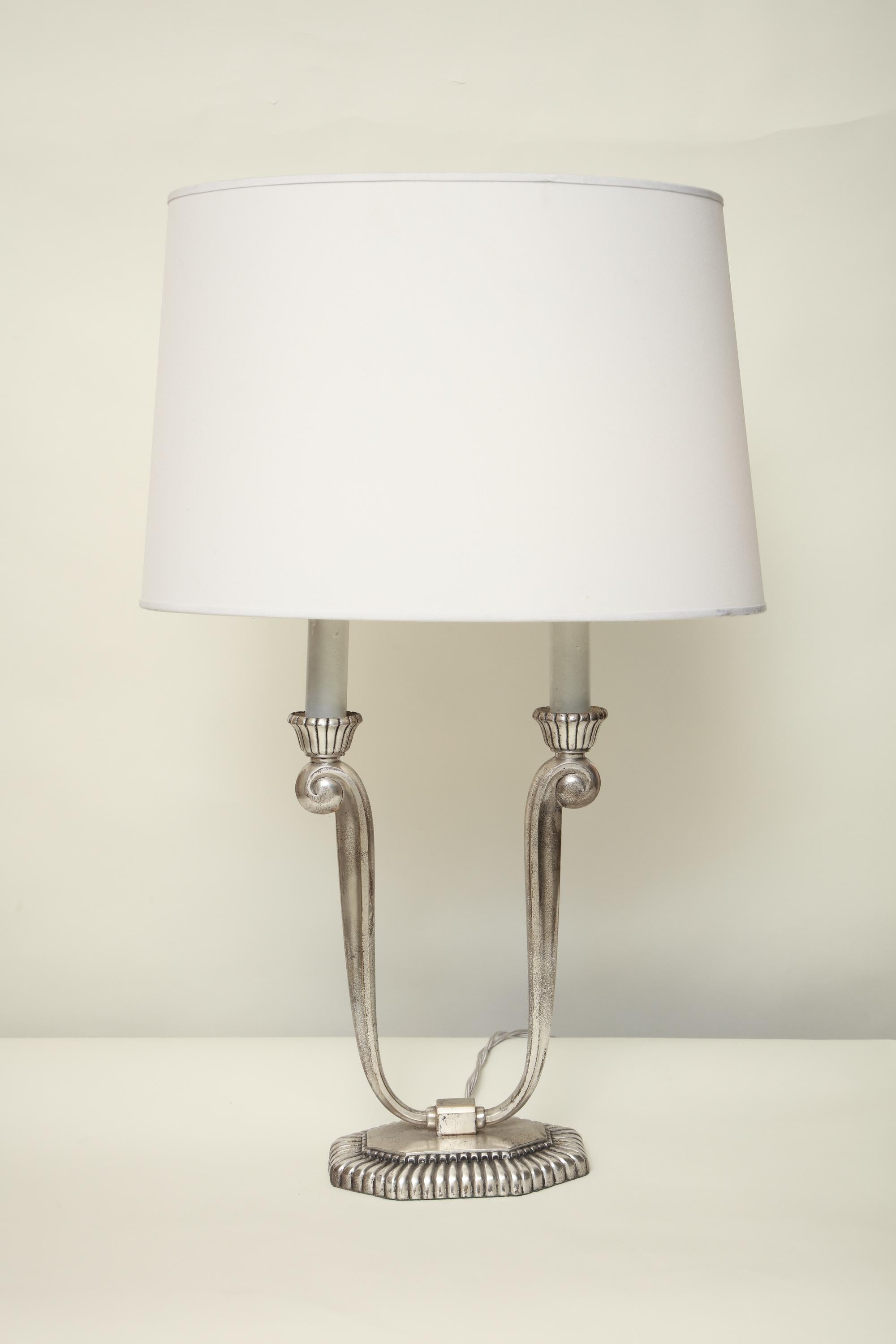 A pair of Art Deco table lamps silver plated over brass silk shades
New sockets and rewired.
