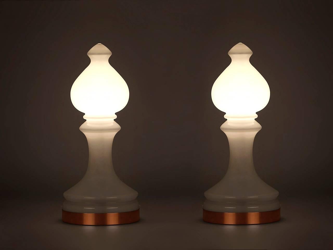 Designed by Ivan Jakeš for Valašské Mezirici in the 1970s. Made of white frosted glass with a copper ring for the base. Modeled after the bishop chess piece. The lamps were completely re-electrified. We offer shop to door delivery worldwide in