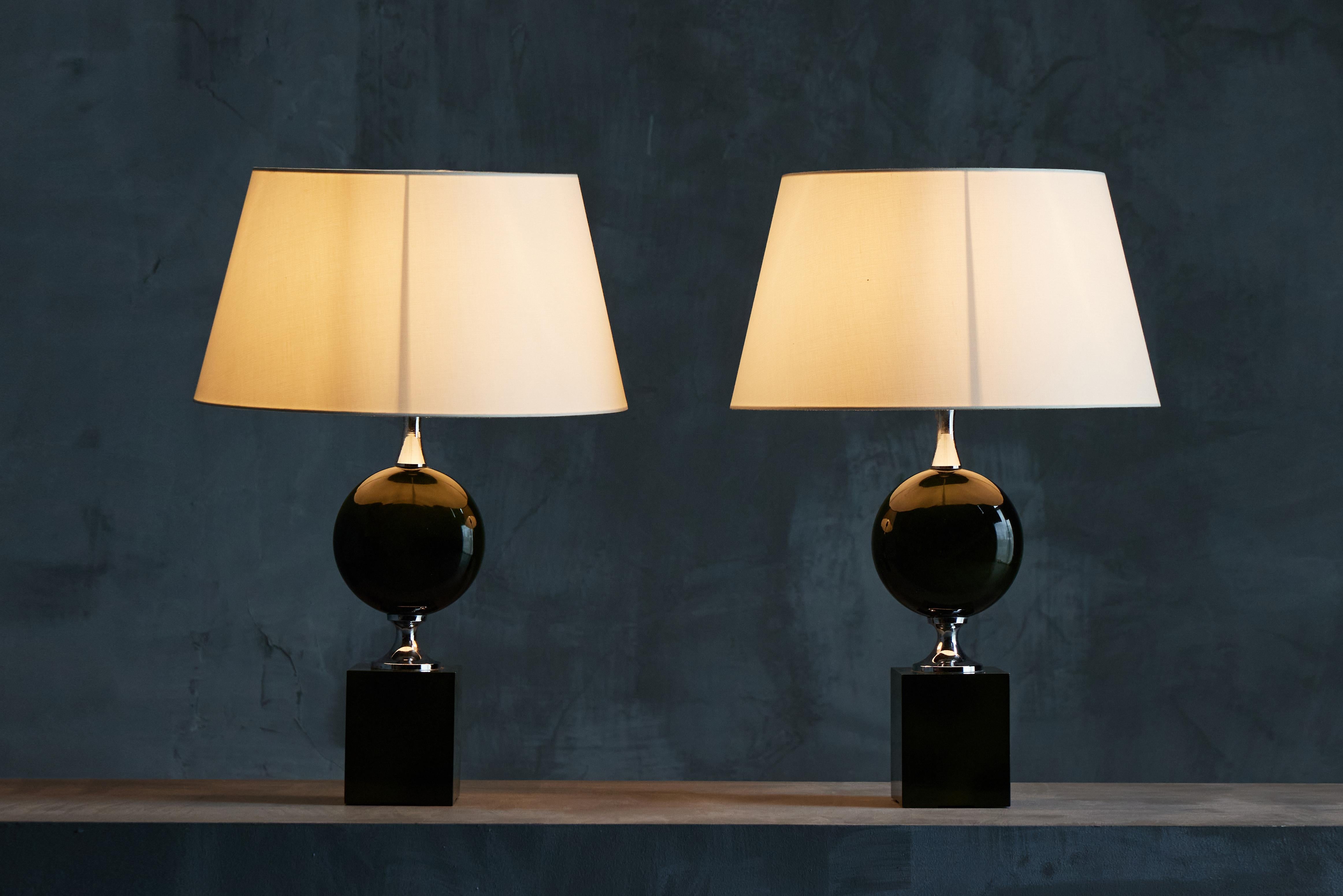 Pair of Philippe Barbier's exquisite table lamps in green lacquer and chrome. Each lamp features a luxurious green lacquered sphere paired with sleek chrome accents. Inspired by neo-classical design elements, this rare Maison Barbier creation