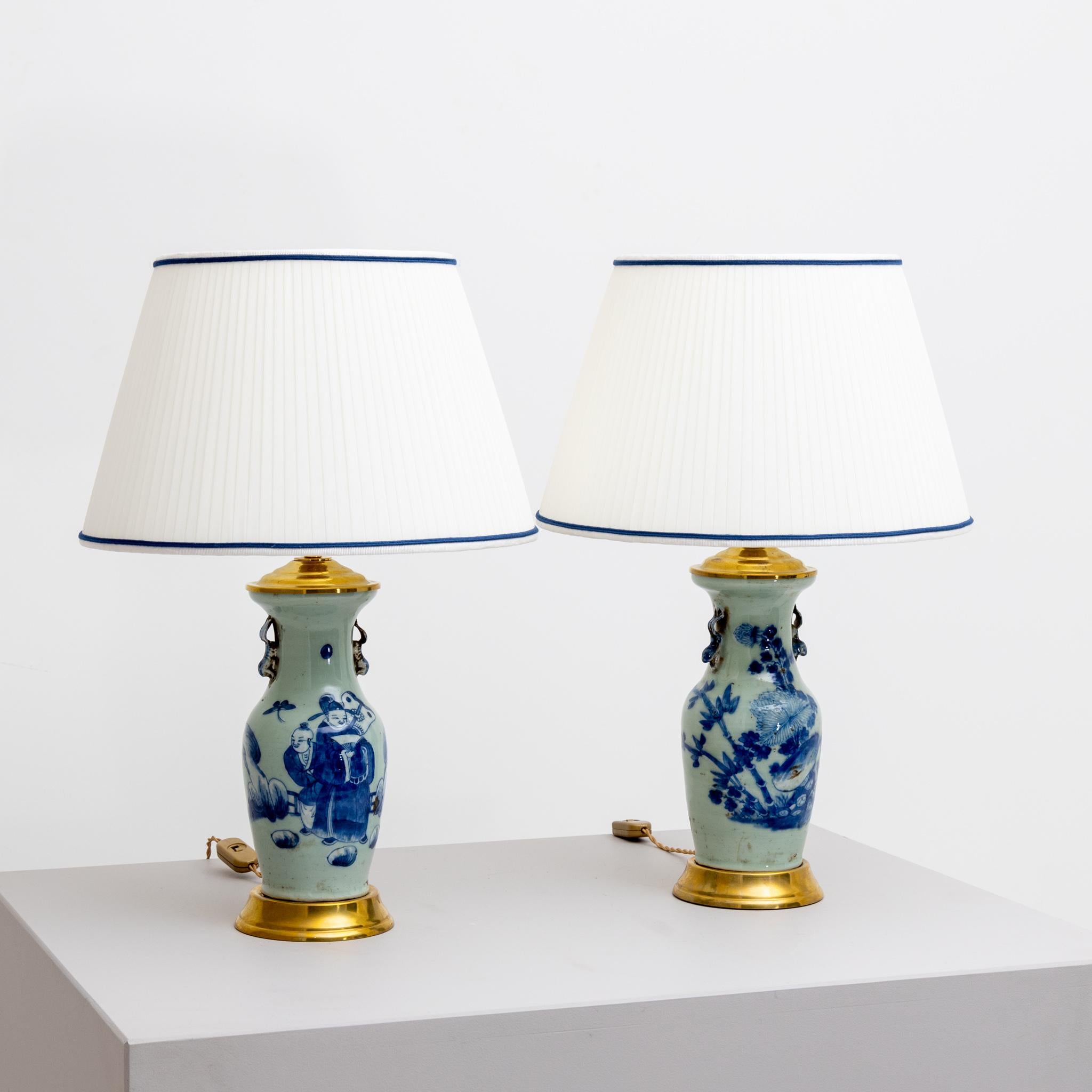 Pair of table lamps made of painted Chinese porcelain with celadon green underlay.