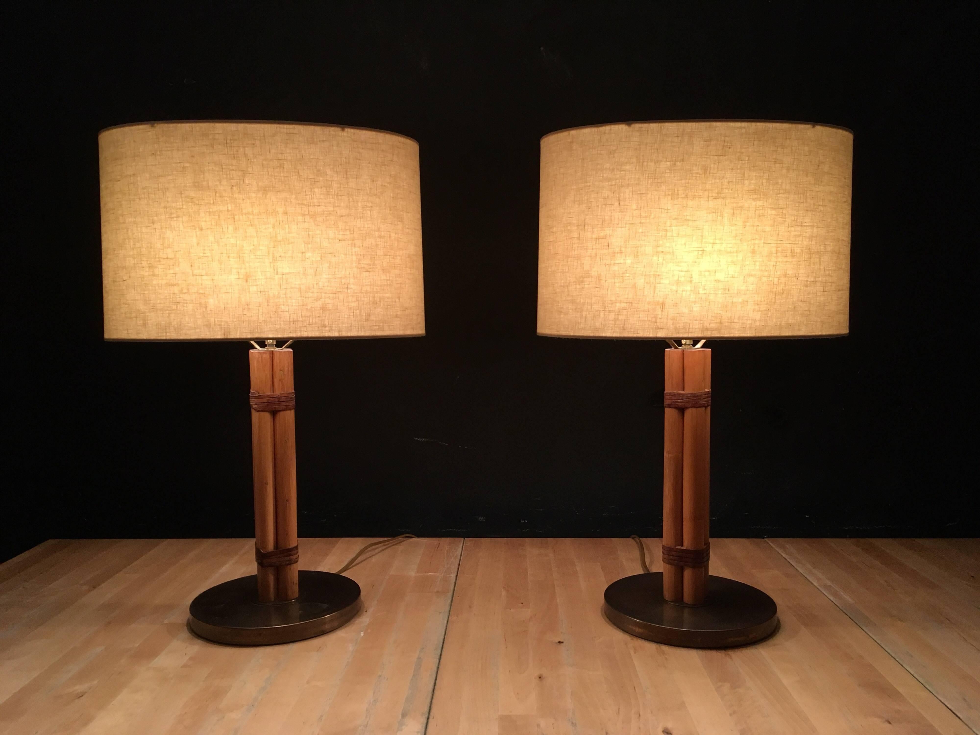 Beautiful Table Lamps, bamboo stems with leather details. Brass bases have a great patina. Made by Bergboms in Sweden.