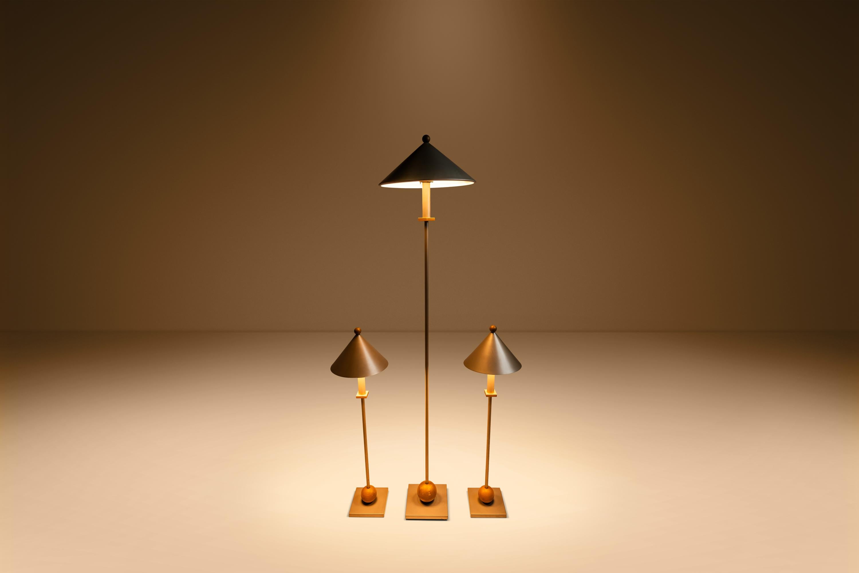 Elevate your interior with this striking set of Post Modern Memphis Style lighting, designed by the renowned George Kovacs and manufactured by Sonneman in the USA during the 1990s. This set includes one floor lamp and two table lamps, each embodying
