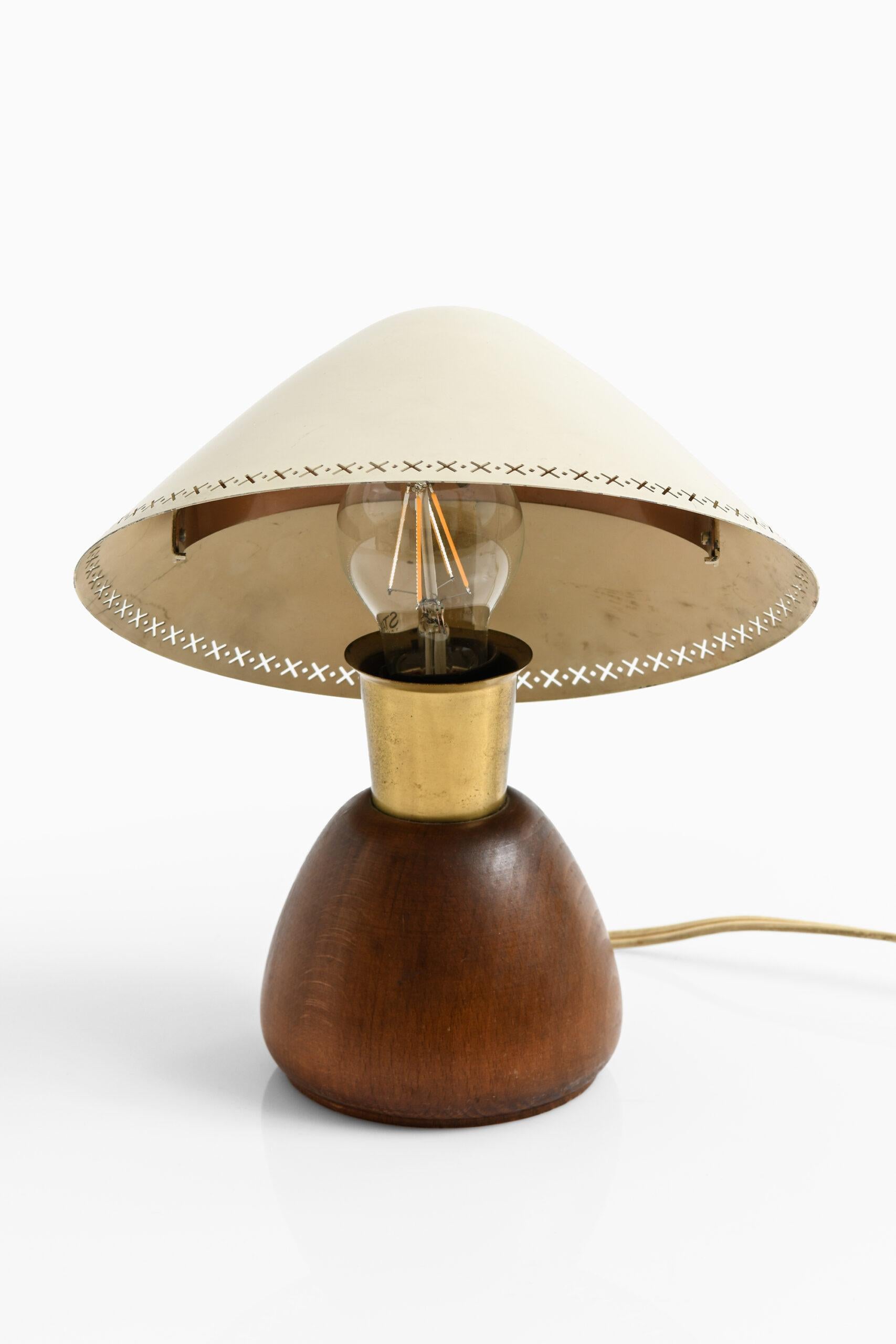 Rare pair of table lamps with adjustable shade by unknown designer. Produced by ASEA in Sweden.