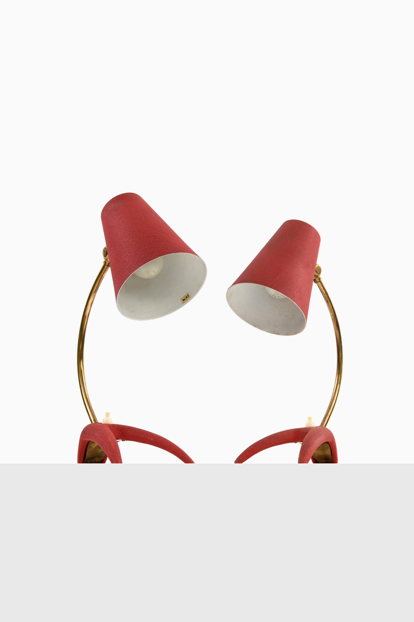 Rare pair of table lamps by unknown designer. Produced by EWÅ in Sweden.