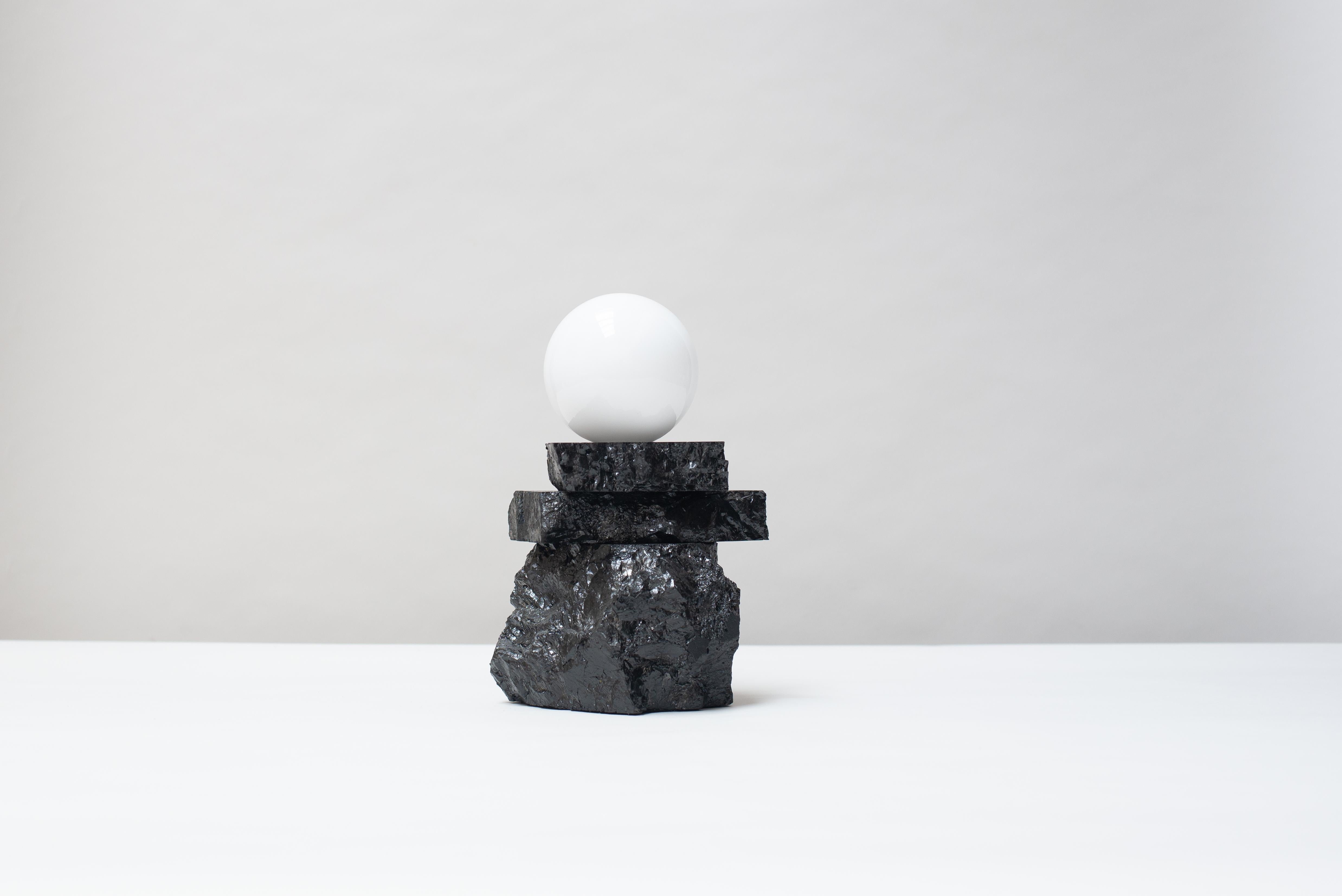 Table light 320 by Jesper Eriksson
Dimensions: D20 x H25 cm 
Materials: Anthracite coal, opal glass
Weight: 5 kg

All our lamps can be wired according to each country. If sold to the USA it will be wired for the USA for instance.

Jesper