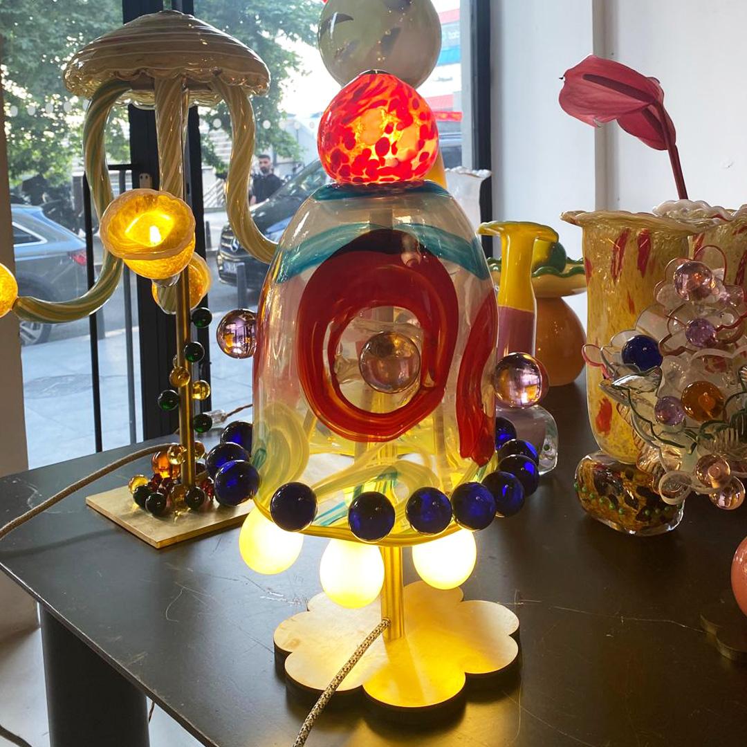 Table Light by Sema Topaloglu

This table light is a unique piece. The light source comes from the glass balls and head. Each production is handcrafted. Therefore, each production is unique and might not be exactly the same as visual.

Sema