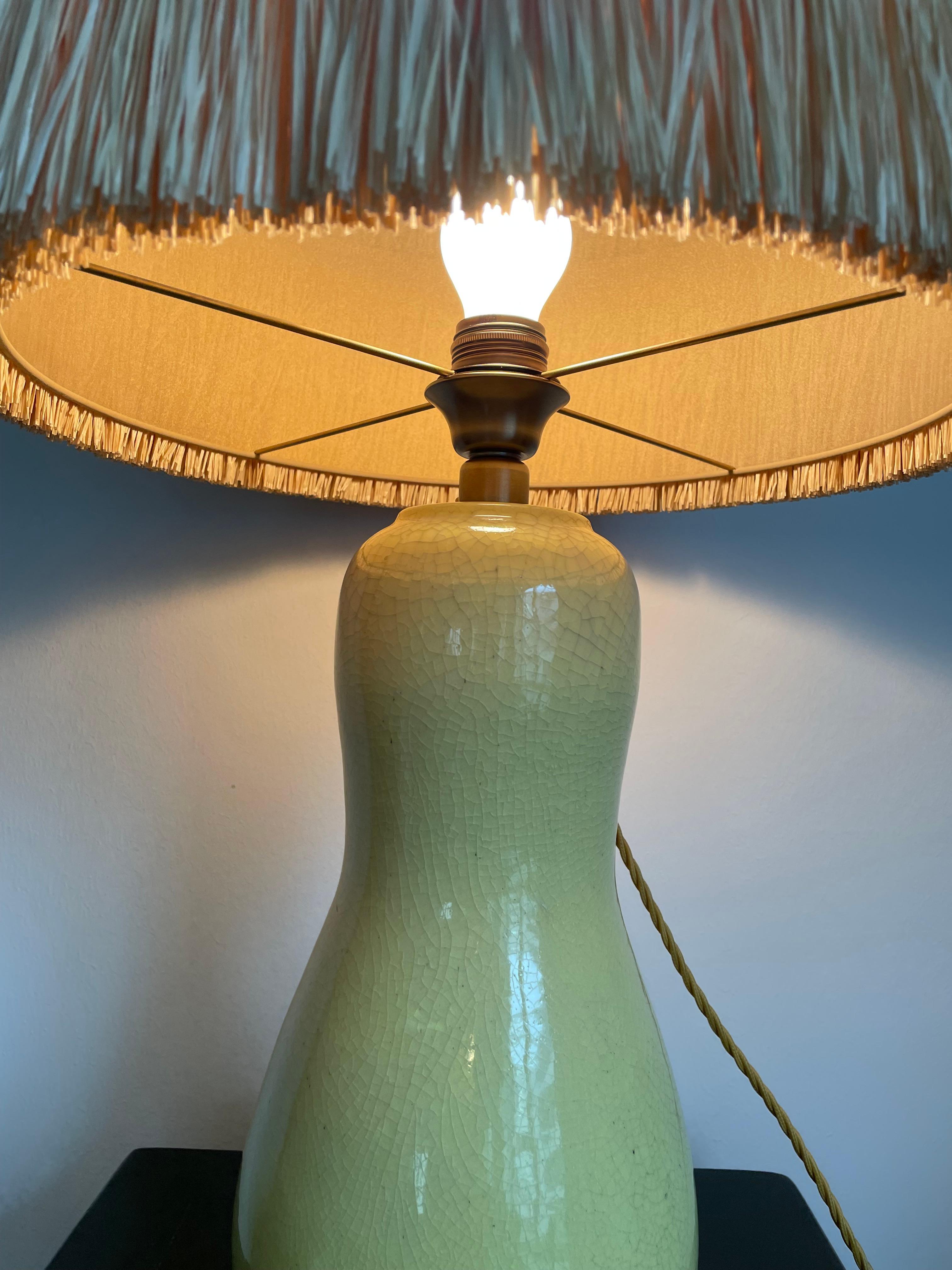 




Glazed ceramic lamp base, squash shaped crackle finish. Signed on bottom Ernestine of Salerno, Italy.
Details of the ceramic base: Height 36cm height x width 15cm to 20cm diameter.
The ceramic base is in a very good condition - no cracks.
We