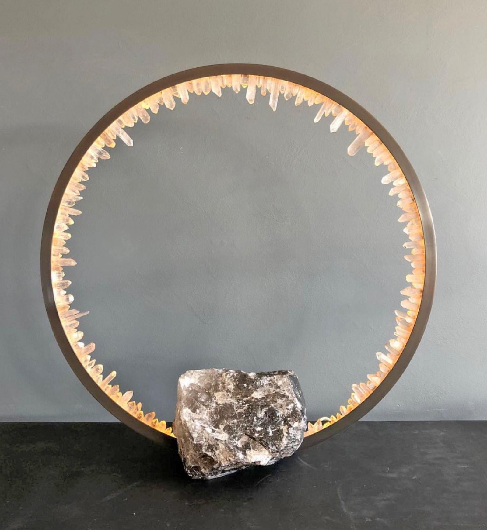 Brass and quartz crystal table light sculpture - Prometheus IV Table Lamp Quartz Base by Christopher Boots.

Emanating luminescence from a minimalist form, PROMETHEUS IV TABLE LAMP embodies the cyclical nature of existence.

Looking through